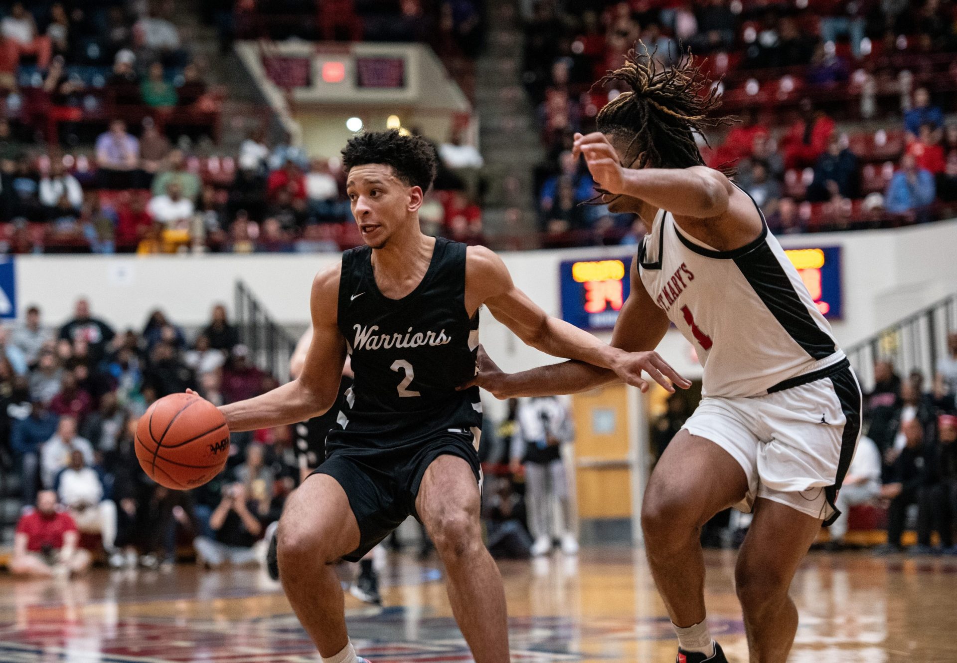 Brother Rice's Elijah Williams dribbles in the paint during the Division 1 boys basketball quarterfinal on Tuesday, March 12, 2024, at Detroit Mercy.