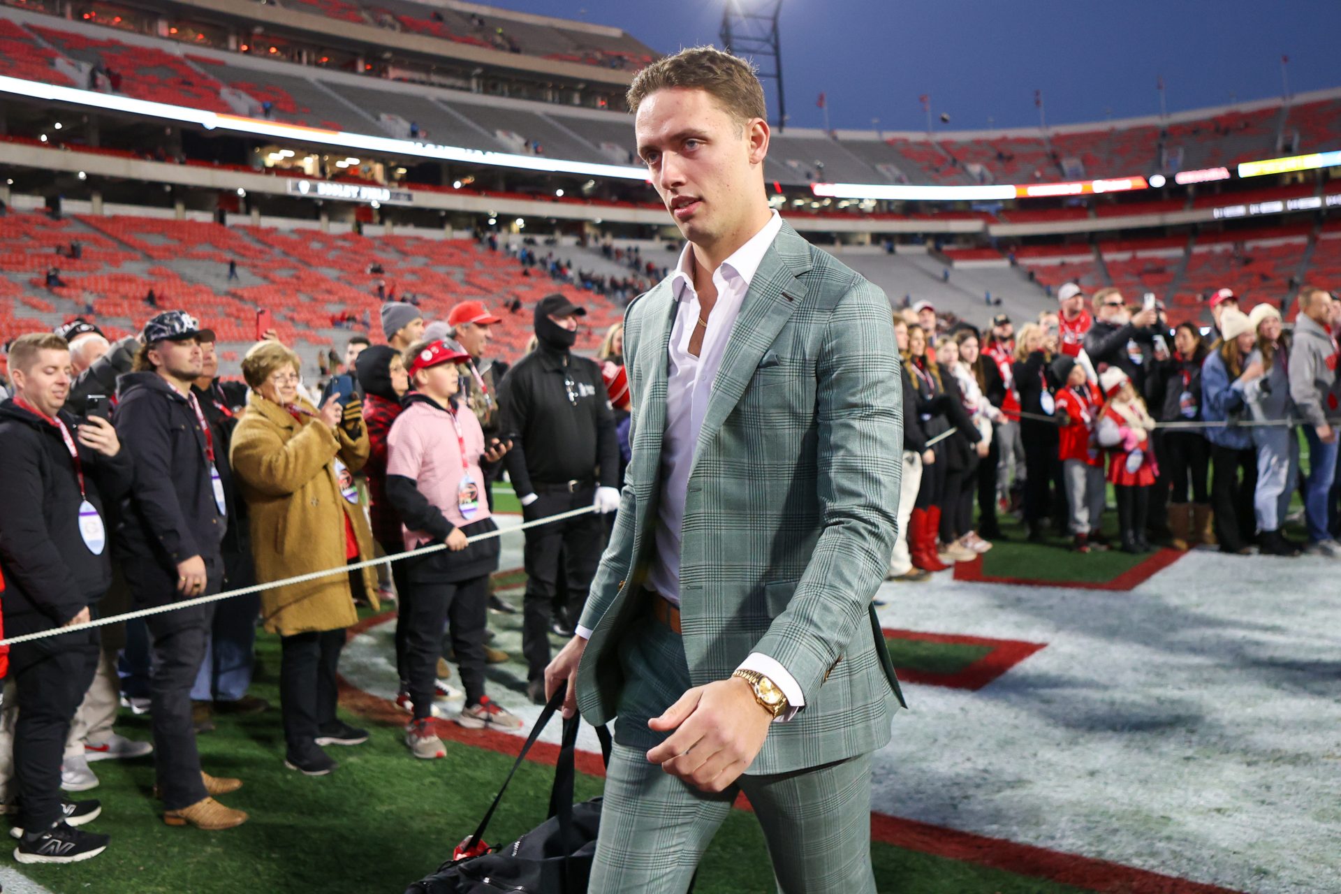 Georgia Bulldogs quarterback Carson Beck (15) walks into Sanford Stadium before a game against the Georgia Tech Yellow Jackets.