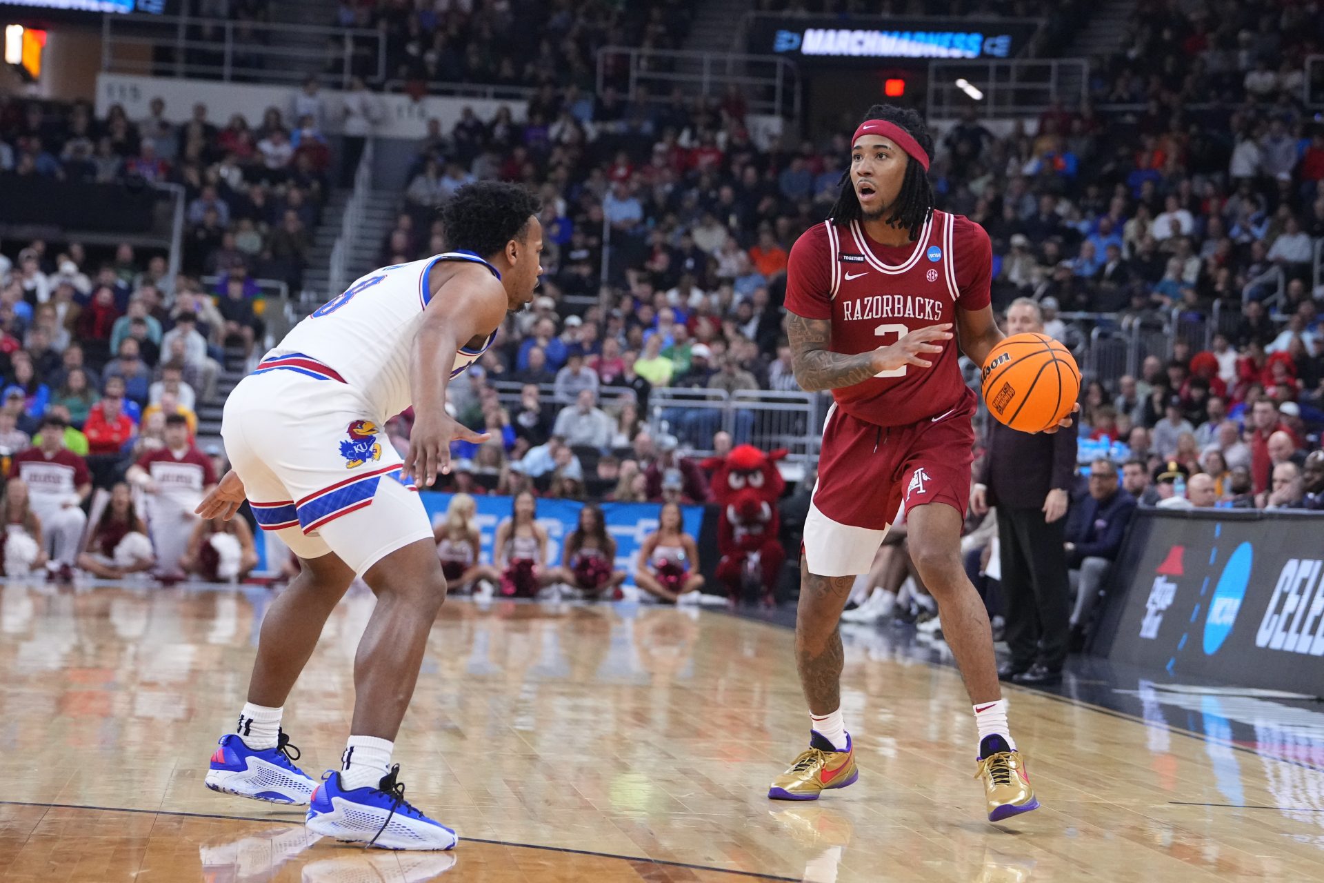 Arkansas Razorbacks guard Boogie Fland (2) controls the ball during the first half against the Kansas Jayhawks at Amica Mutual Pavilion.