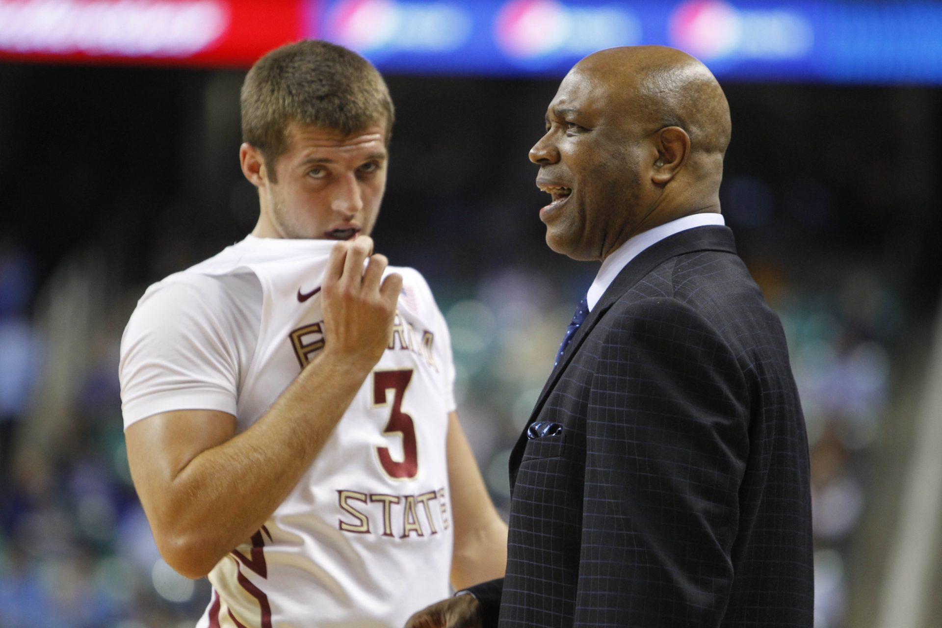 Florida State Seminoles head coach Leonard Hamilton reacts as guard Luke Loucks (3) looks on in the first half in the quarterfinals of the 2011 ACC Tournament at the Greensboro Coliseum.