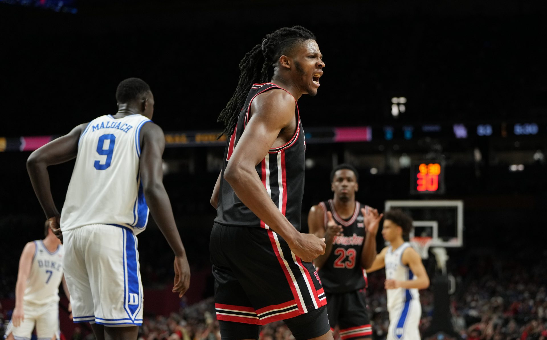 Houston Cougarsforward Joseph Tugler(11) reacts after a play against the Duke Blue Devils during the second half in the semifinals of the men's Final Four of the 2025 NCAA Tournament at the Alamodome.