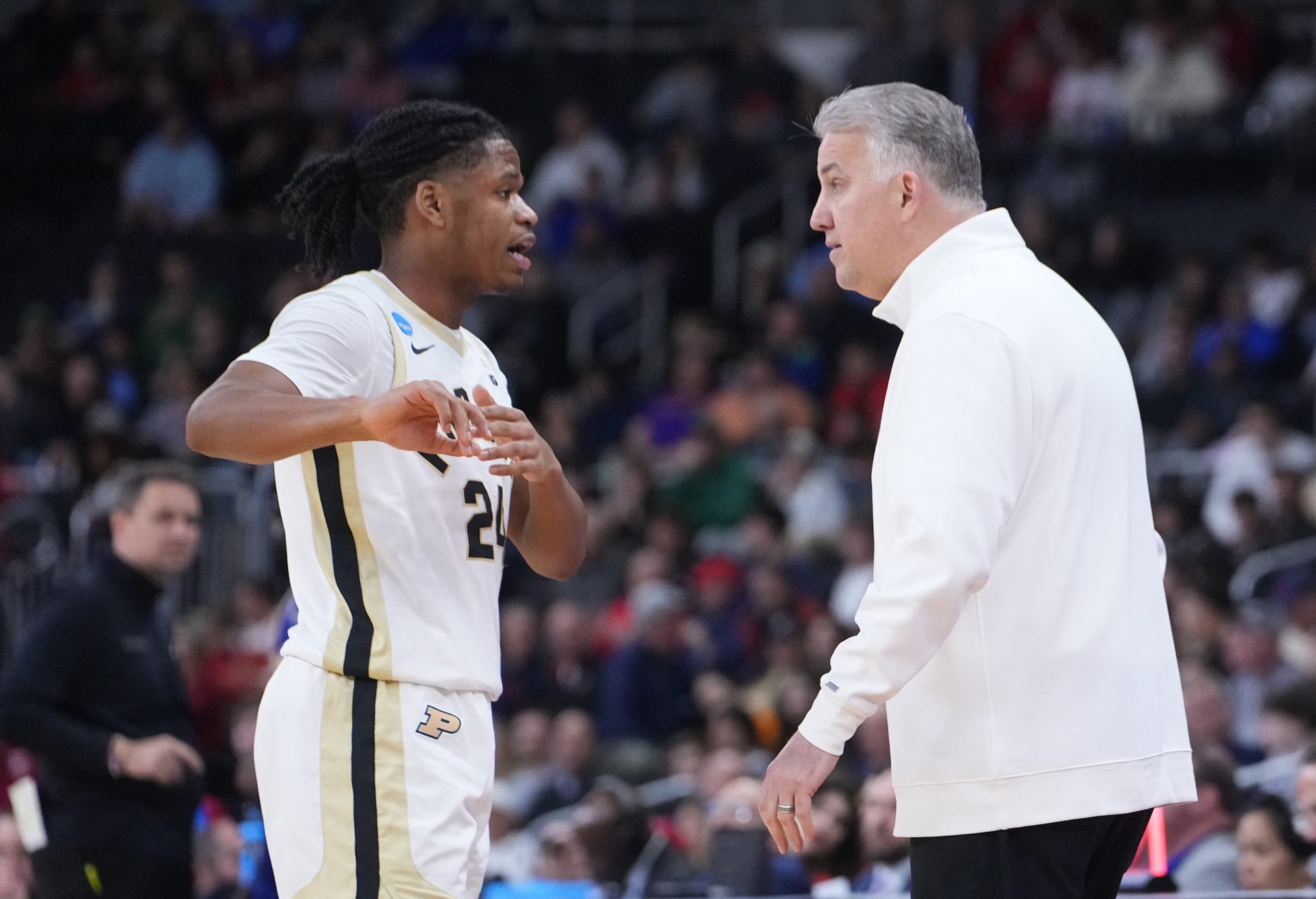 Purdue Boilermakers guard Gicarri Harris (24) talks to head coach Matt Painter during the second half of a second round men’s NCAA Tournament game against the McNeese State Cowboys at Amica Mutual Pavilion.