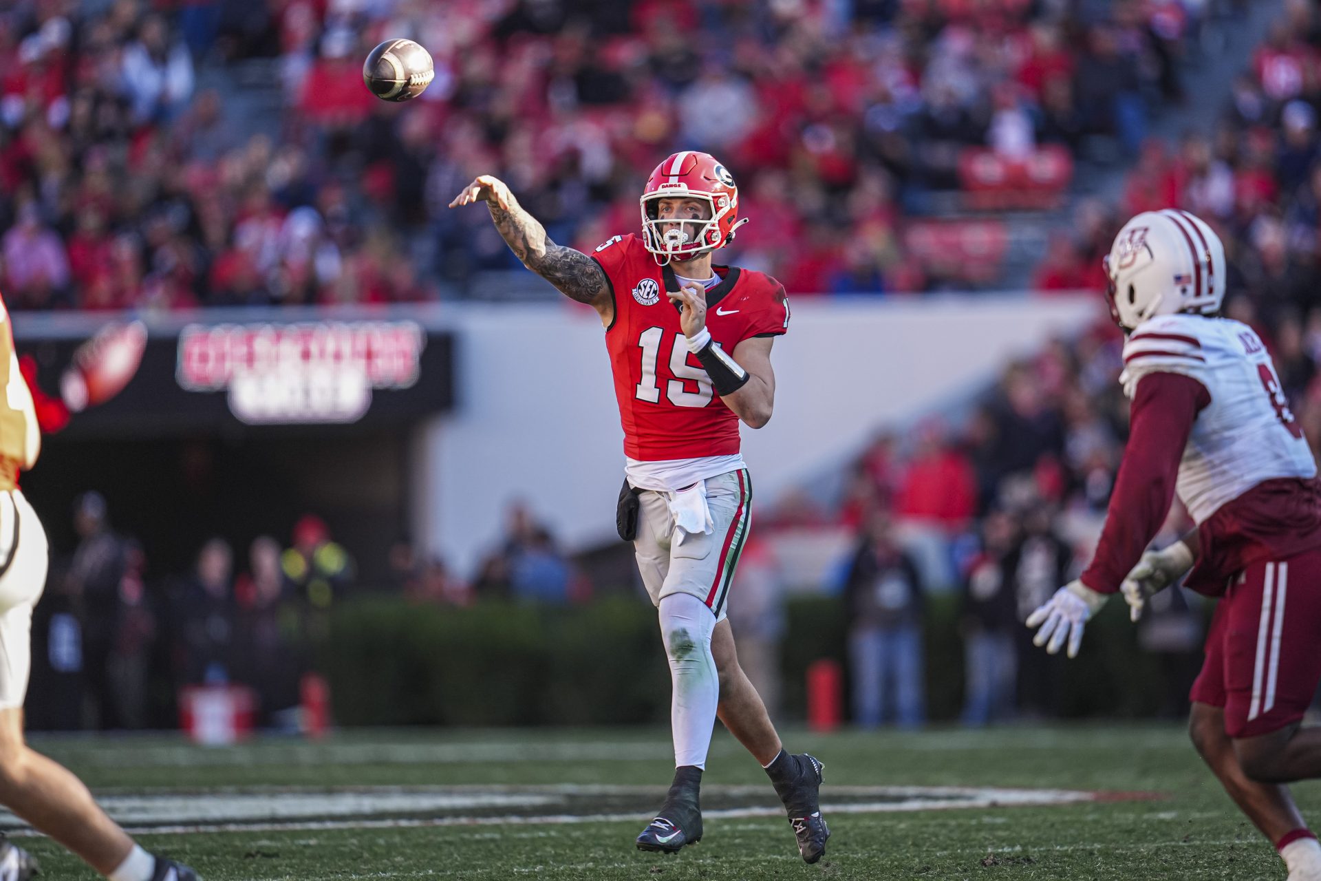Georgia Bulldogs quarterback Carson Beck (15) passes the ball against the Massachusetts Minutemen during the second half at Sanford Stadium.