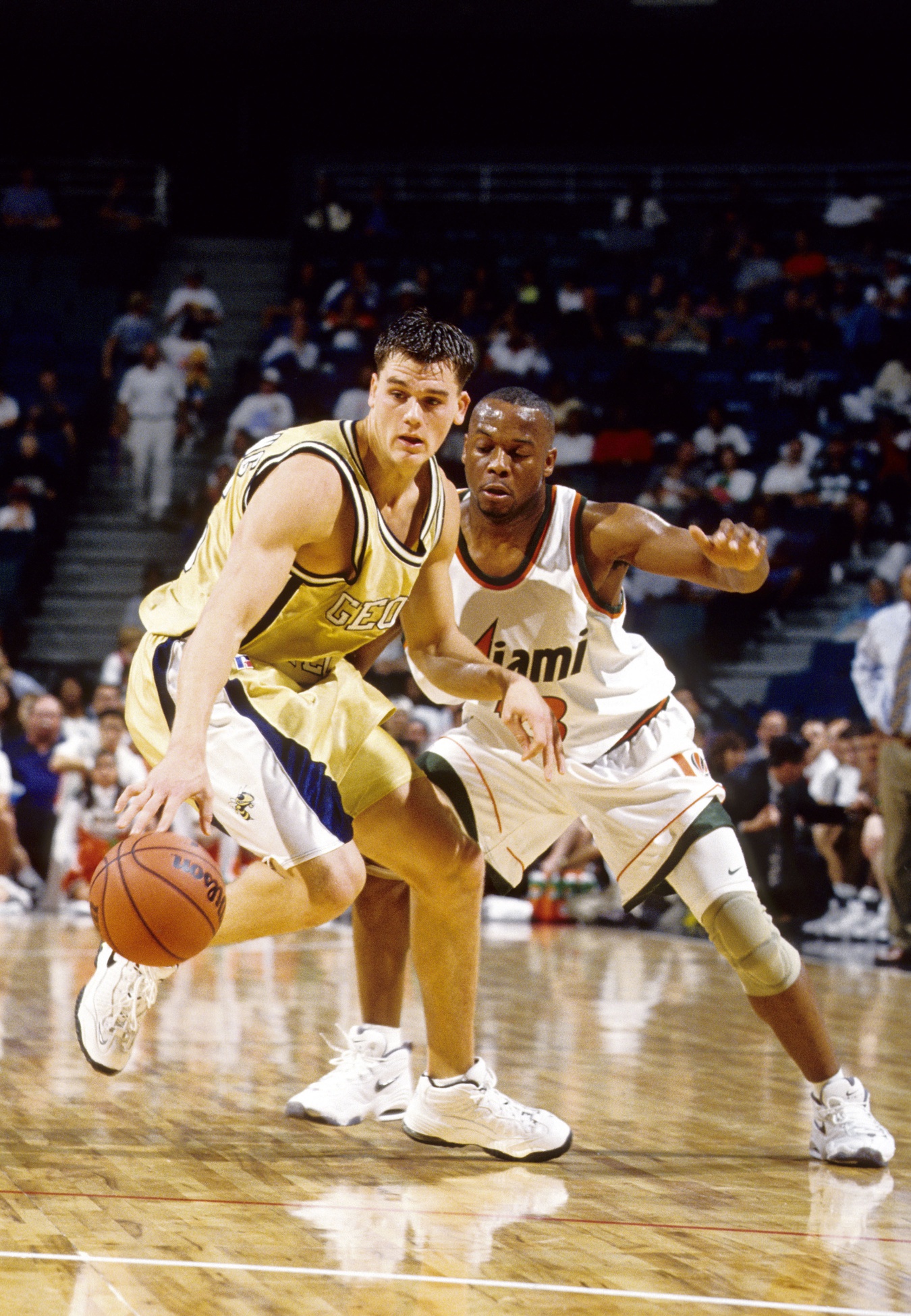 FILE PHOTO; Georgia Tech Yellow Jackets forward Matt Harpring in action against  Miami Hurricanes guard Steve Frazier (13) at Miami Arena.