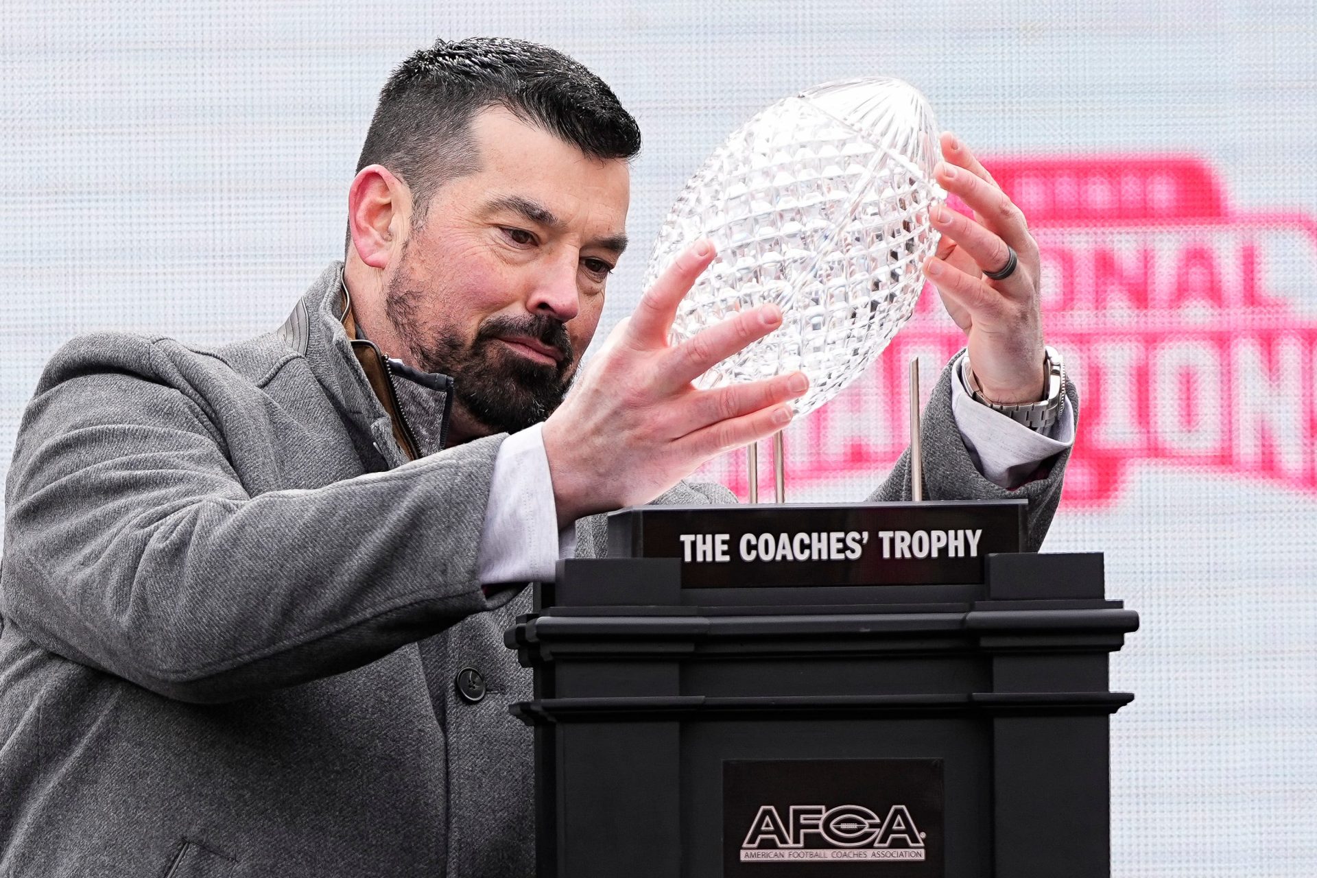 Ohio State Buckeyes head coach Ryan Day holds the AFCA Coaches' Trophy during the Ohio State Buckeyes College Football Playoff National Championship