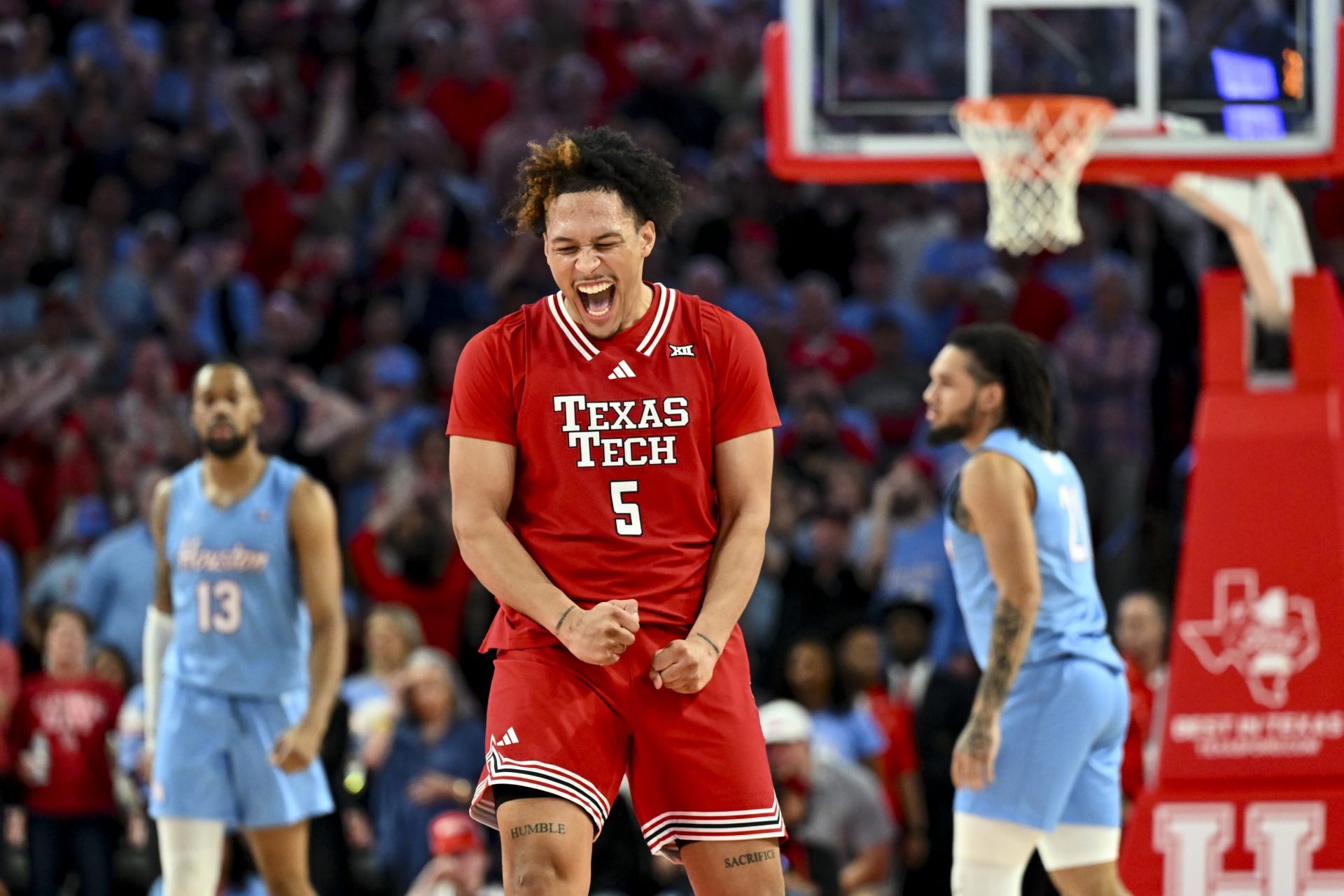 Texas Tech Red Raiders forward Darrion Williams (5) reacts after shooting a three point basket to tie the game with seconds left on the clock against the Houston Cougars at Fertitta Center.