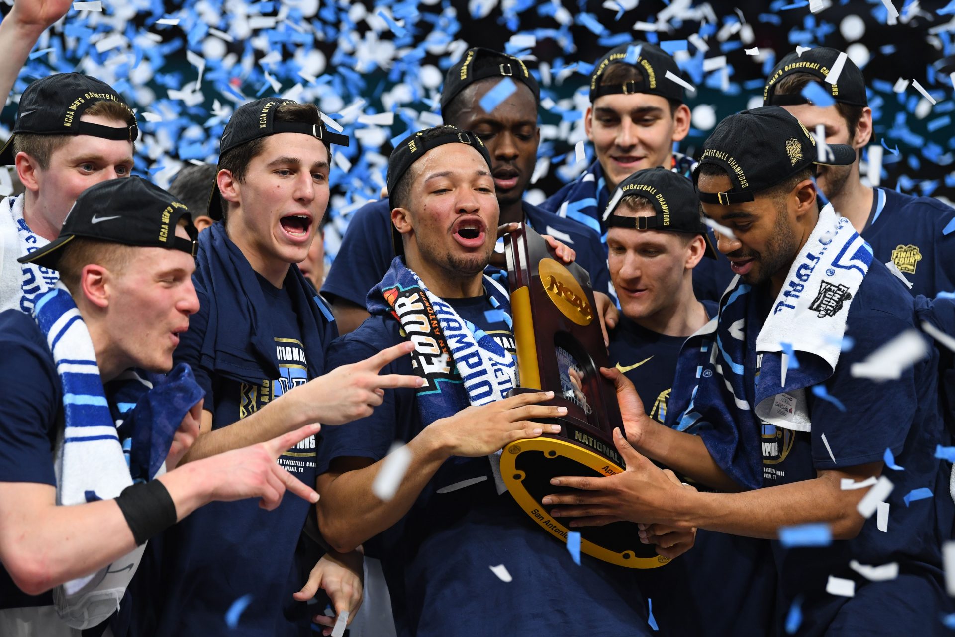 Villanova Wildcats guard Jalen Brunson (1) holds the national championship trophy after defeating the Michigan Wolverines 79-62 in the championship game of the 2018 men's Final Four at Alamodome.