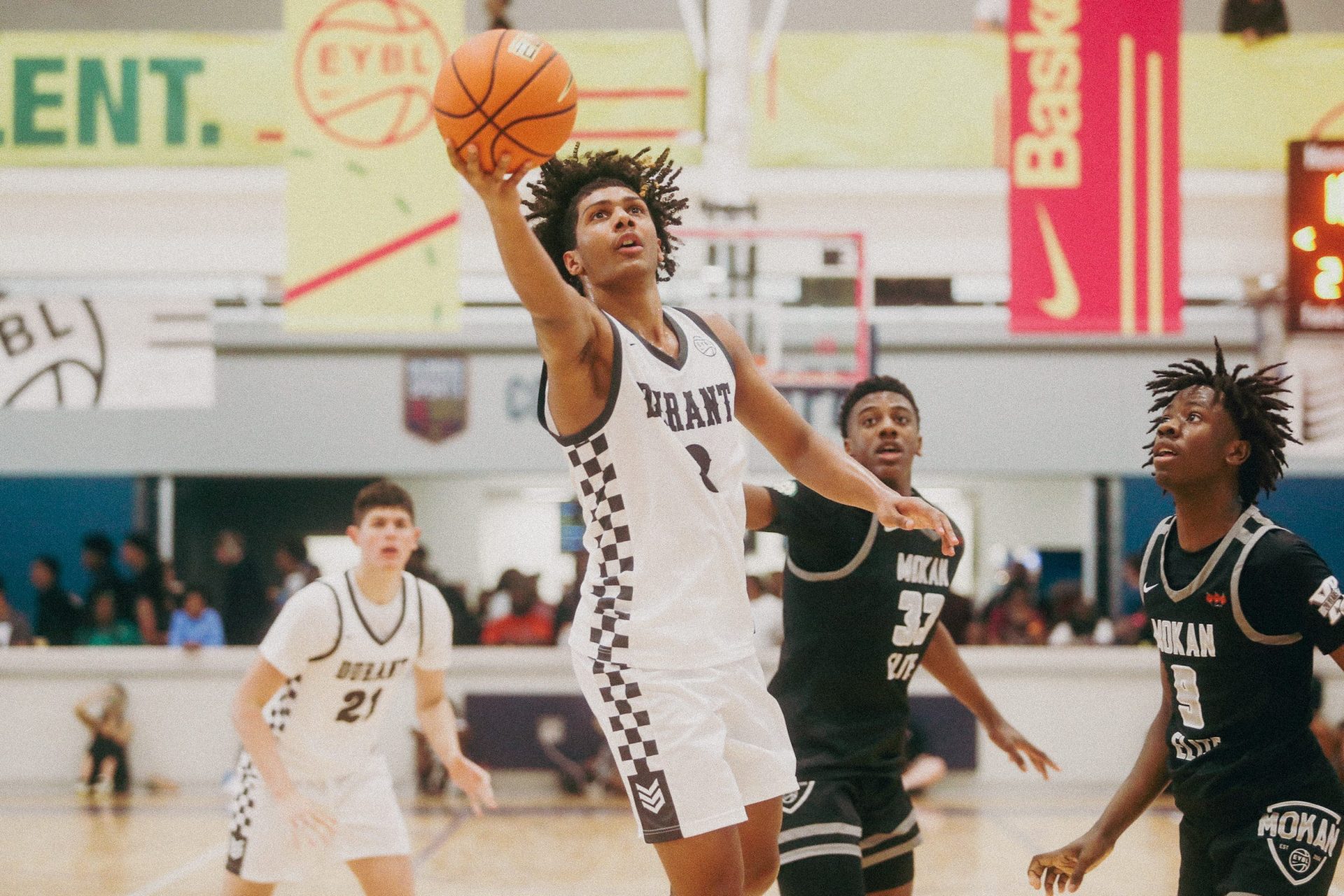 Team Durant's Acaden Lewis (8) goes for a lay up during a game against Team Mokan Elite during the Nike Elite Youth Basketball League