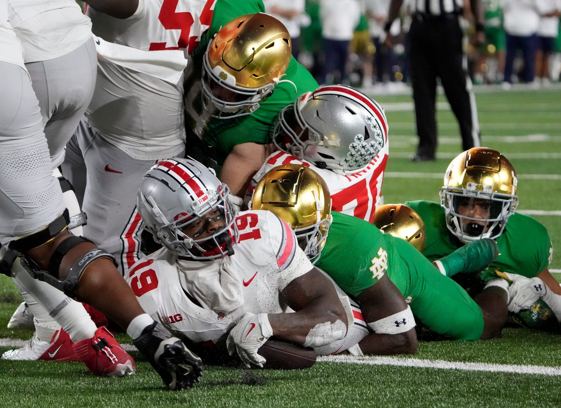 Ohio State Buckeyes running back Chip Trayanum (19) scores the game winning rushing touchdown against Notre Dame Fighting Irish during the fourth quarter of their game at Notre Dame Stadium.