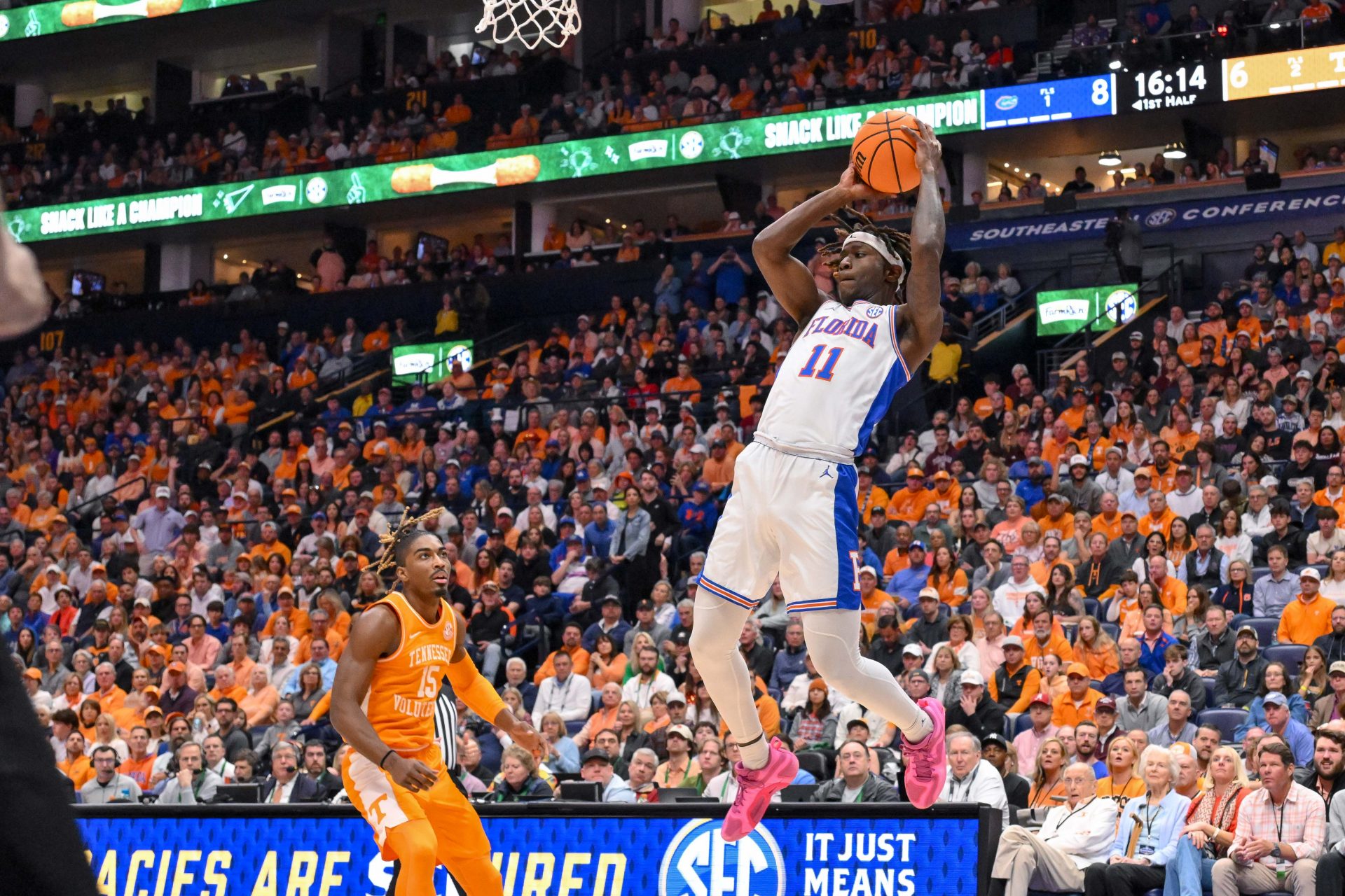 Florida Gators guard Denzel Aberdeen (11) lays the ball in against the Tennessee Volunteers during the first half at the 2025 SEC Championship Game at Bridgestone Arena.