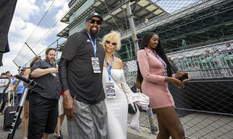 Indiana University head basketball coach Mike Woodson walks through the pits with his wife Terri Woodson and daughter Mariah Woodson during the third day of practice for the 106th Indianapolis 500 at the Indianapolis Motor Speedway. Mandatory Credit: Mar
