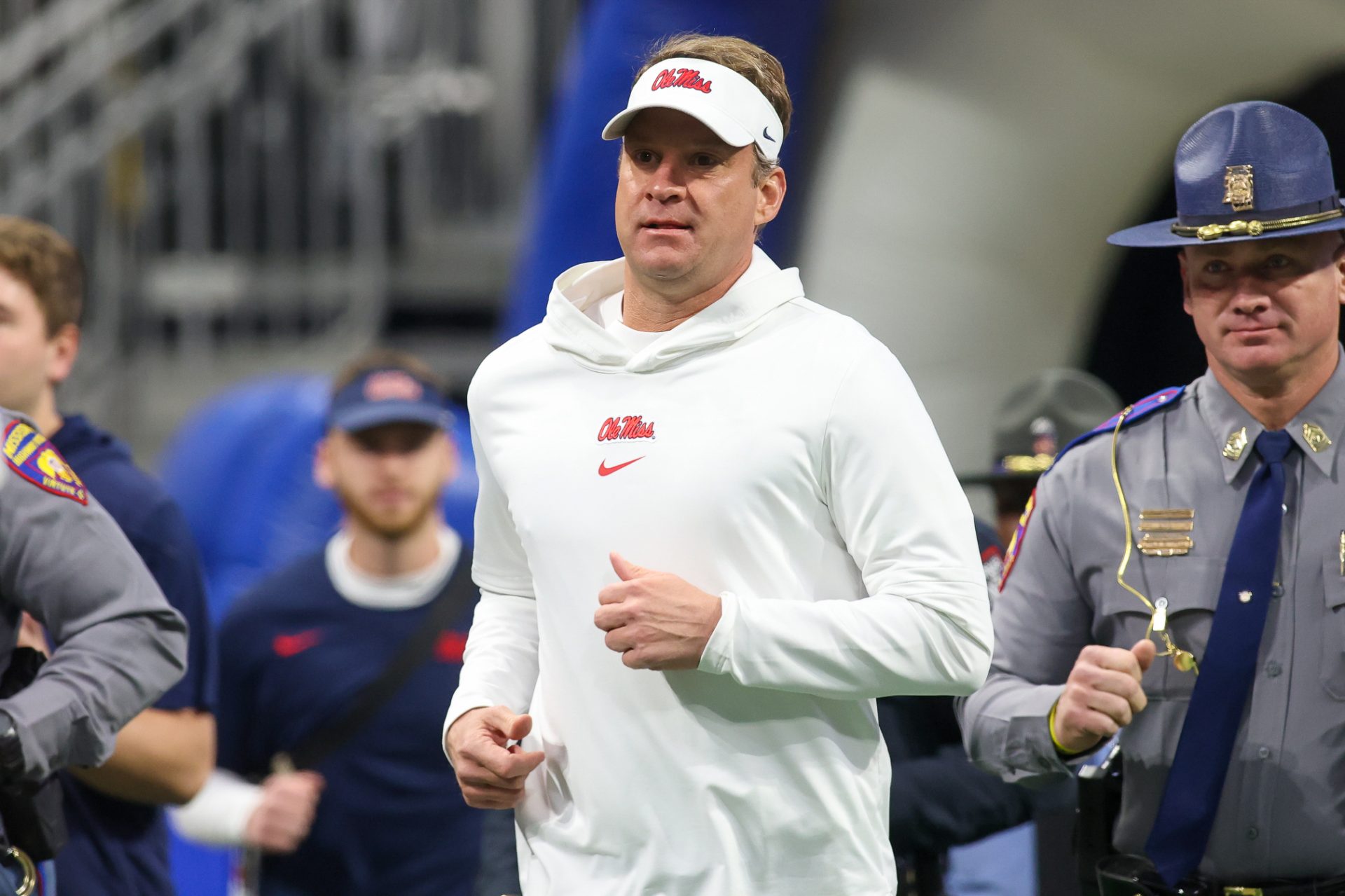 Mississippi Rebels head coach Lane Kiffin runs on the field before a game against the Penn State Nittany Lions at Mercedes-Benz Stadium.