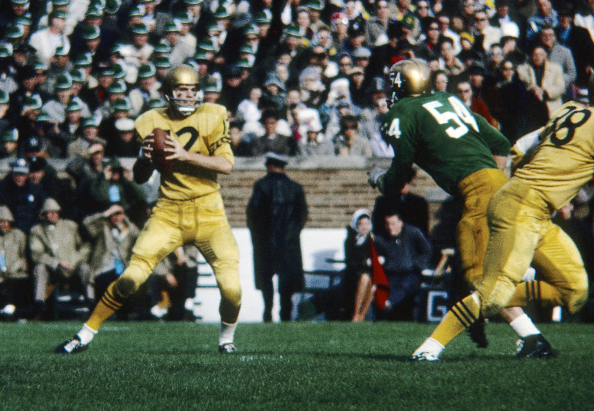 Nov 2, 1963, Notre Dame, IN, USA; FILE PHOTO; Navy Midshipmen quarterback Roger Staubach (12) looks to throw against the Notre Dame Fighting Irish at Notre Dame Stadium  during the 1963 season.