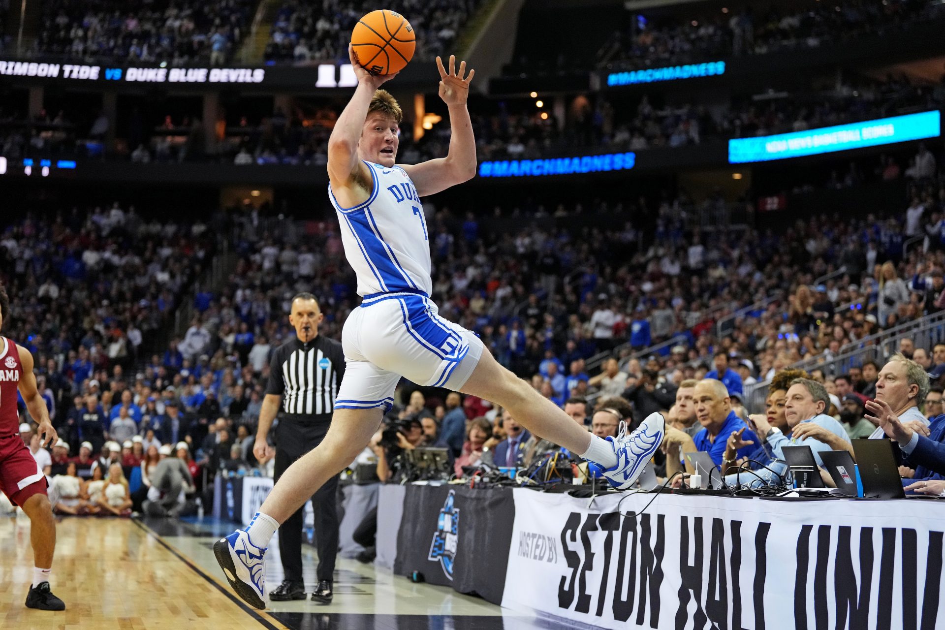 Duke Blue Devils guard Kon Knueppel (7) saves the ball from going out of bound during the first half against the Alabama Crimson Tide in the East Regional final of the 2025 NCAA tournament at Prudential Center.