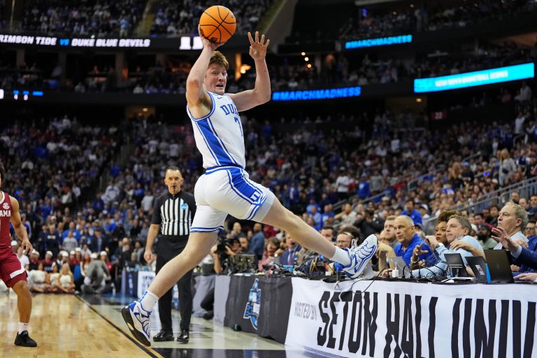 Duke Blue Devils guard Kon Knueppel (7) saves the ball from going out of bound during the first half against the Alabama Crimson Tide in the East Regional final of the 2025 NCAA tournament at Prudential Center.