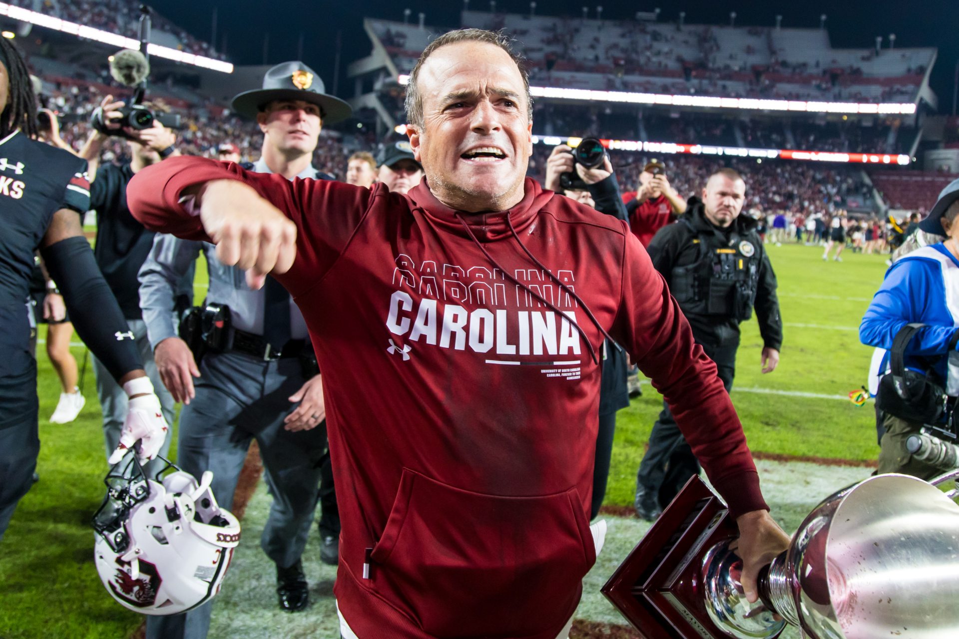 South Carolina Gamecocks head coach Shane Beamer celebrates beating the Missouri Tigers at Williams-Brice Stadium. He is holding the Mayors Cup, given to the winner of the South Carolina-Missouri game
