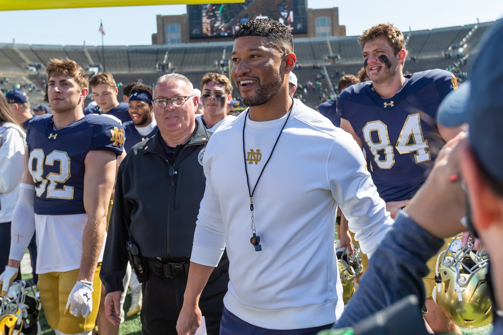 Notre Dame Fighting Irish head coach Marcus Freeman smiles as he walks off the field after the Blue-Gold game at Notre Dame Stadium.