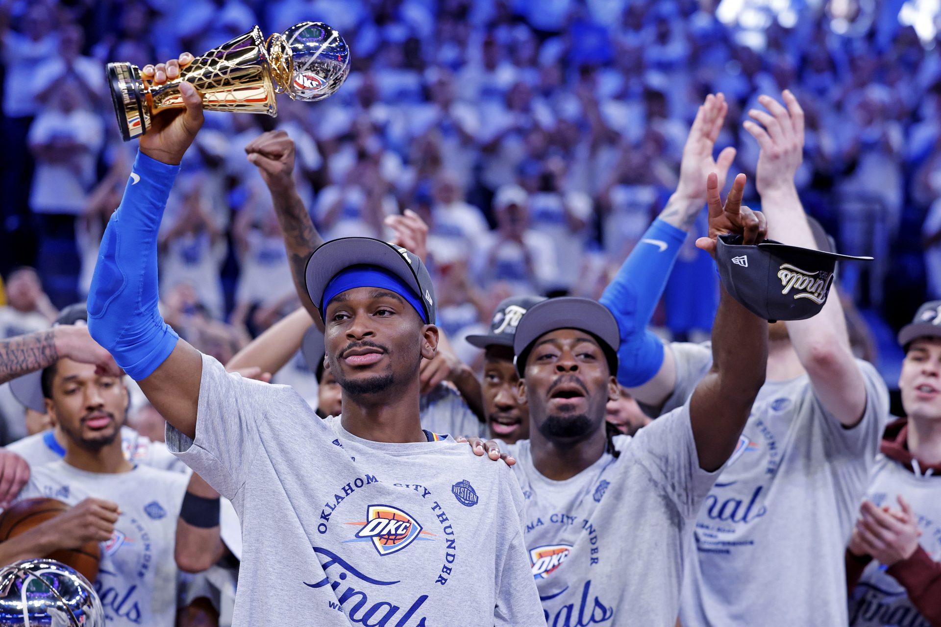 Oklahoma City Thunder guard Shai Gilgeous-Alexander (2) celebrates with Magic Johnson West Conference Finals MVP trophy after defeating the Minnesota Timberwolves in game five to win the western conference finals for the 2025 NBA Playoffs at Paycom Center.