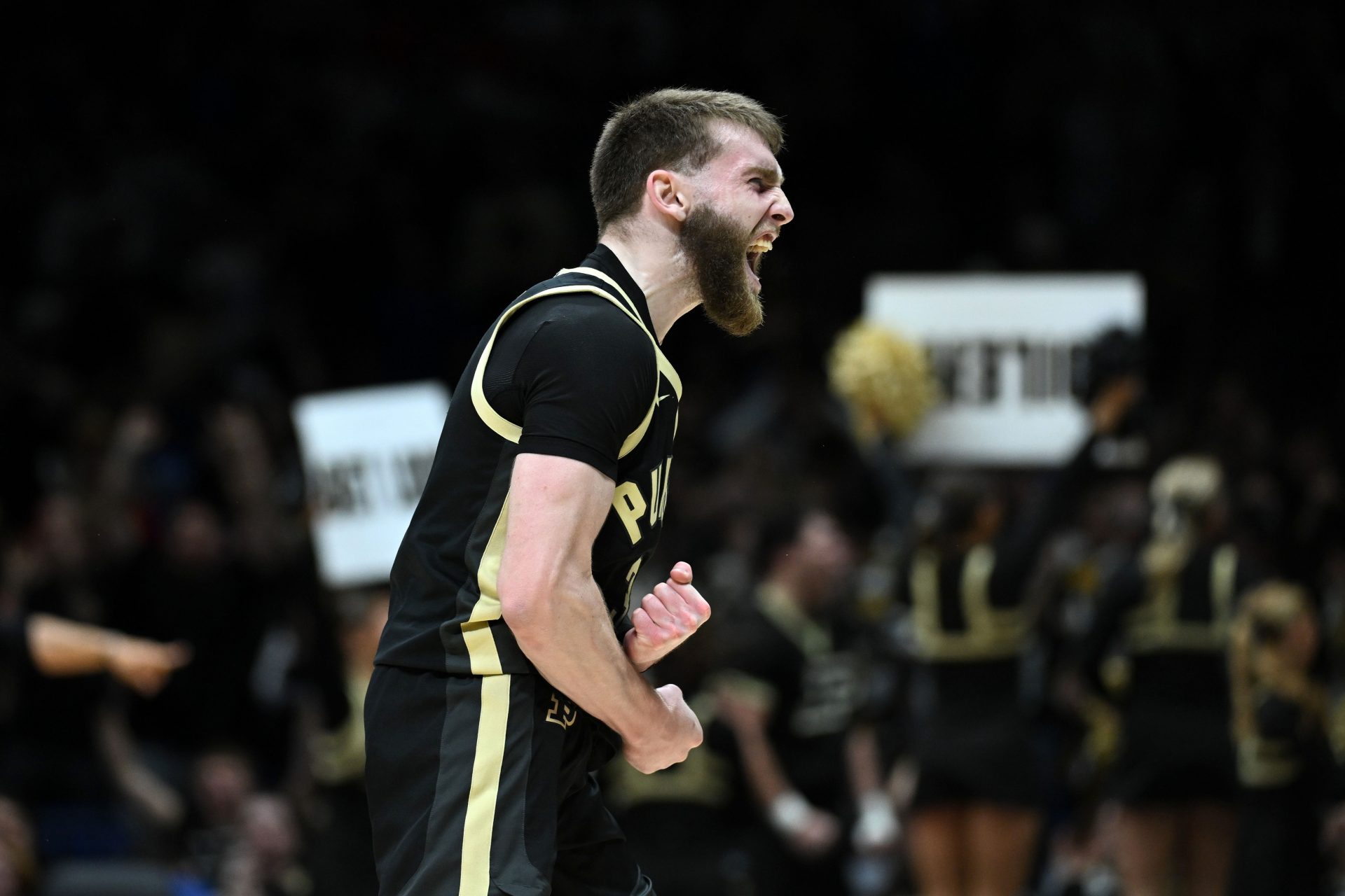 Purdue Boilermakers guard Braden Smith (3) reacts against Houston Cougars forward Joseph Tugler (11) in the second half during a Midwest Regional semifinal of the 2025 NCAA tournament at Lucas Oil Stadium.