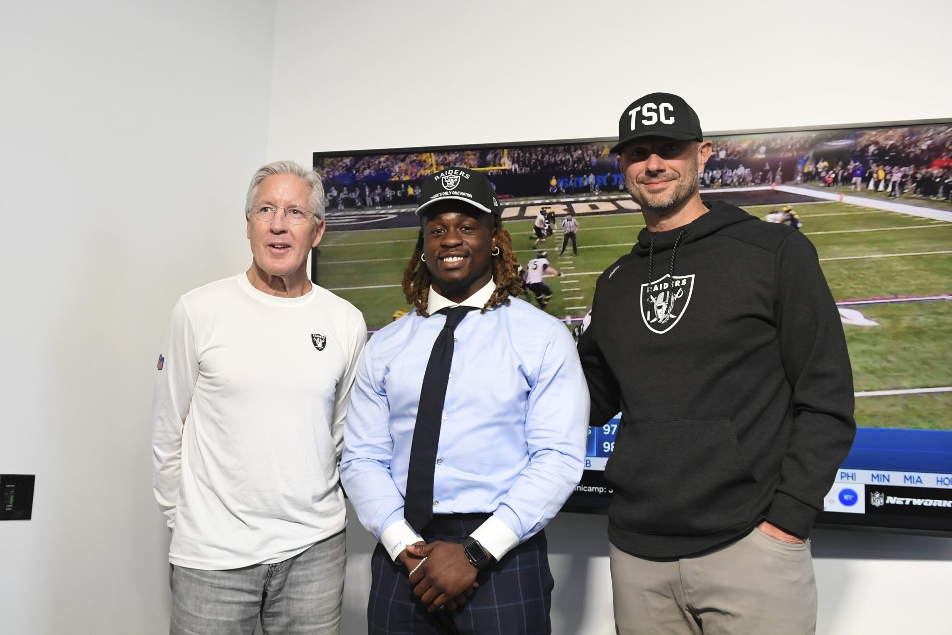 Las Vegas Raiders head coach Pete Carroll, Ashton Jeanty and general manager John Spytek pose after a news conference introducing Jeanty as the first round draft pick in the 2025 NFL Draft at Intermountain Health Performance Center.
