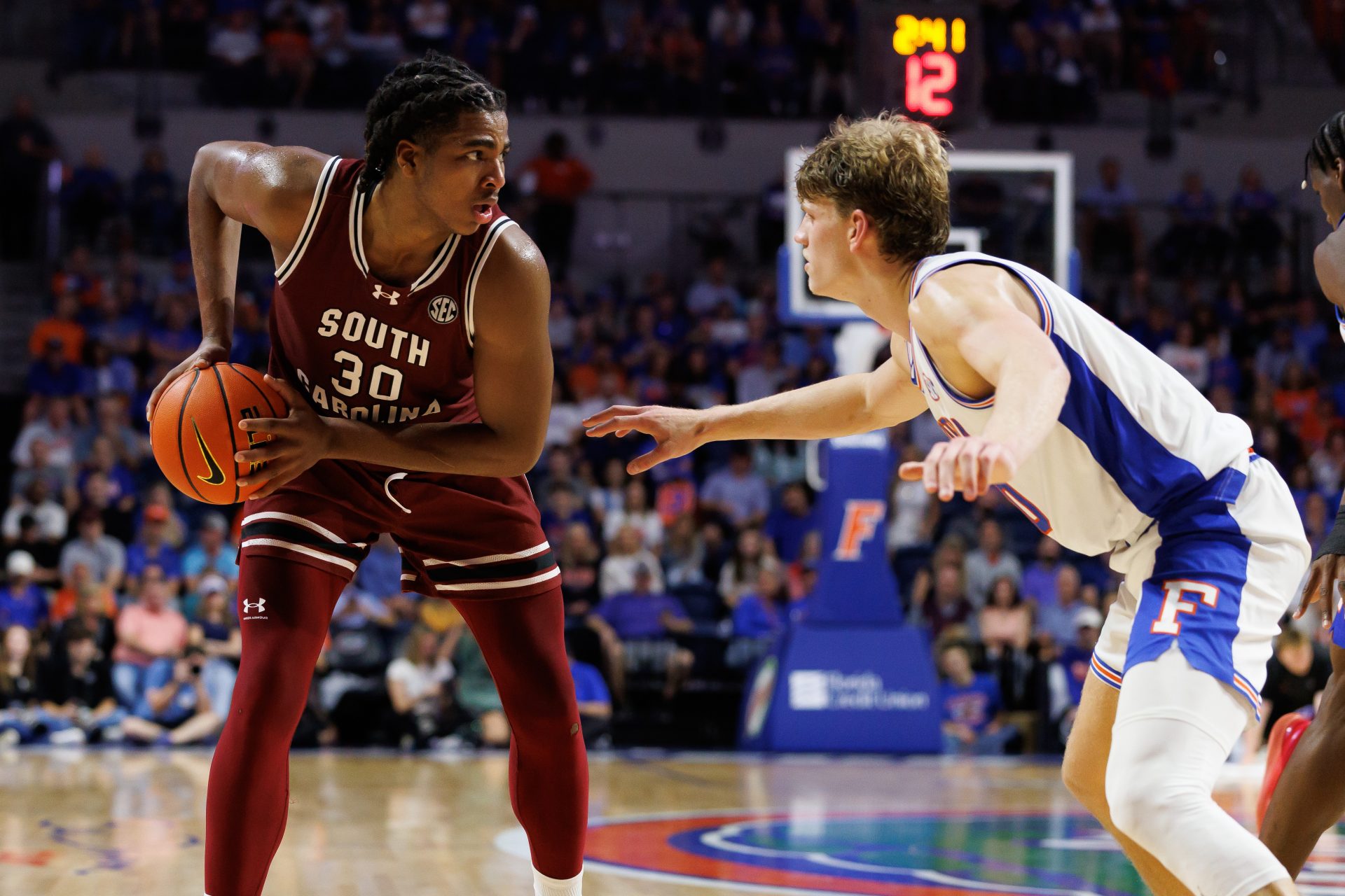 South Carolina Gamecocks forward Collin Murray-Boyles (30) posts up against Florida Gators forward Thomas Haugh (10) during the first half at Exactech Arena at the Stephen C. O'Connell Center.