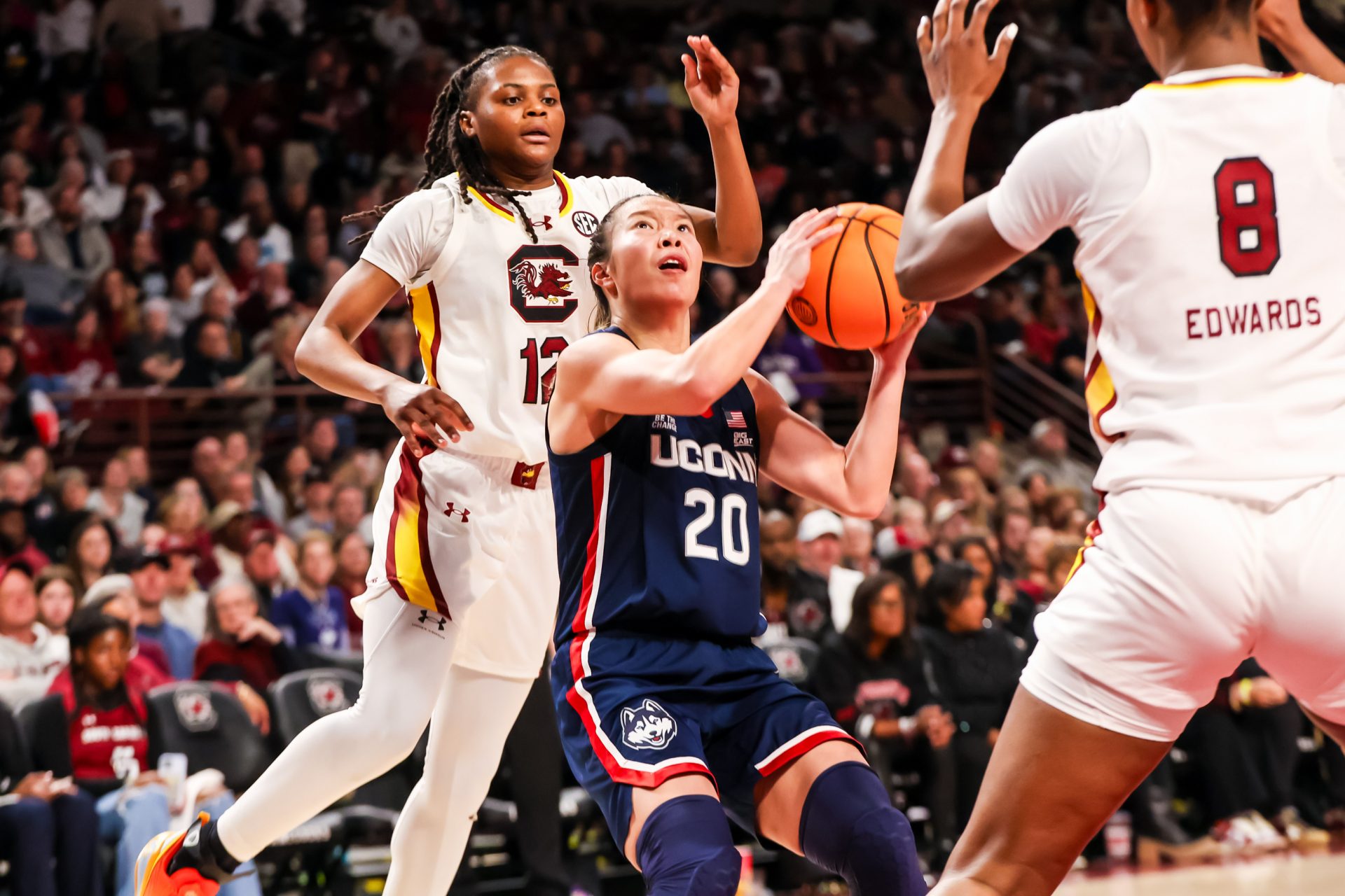 UConn Huskies guard Kaitlyn Chen (20) drives past South Carolina Gamecocks guard MiLaysia Fulwiley (12) and forward Joyce Edwards (8) in the second half at Colonial Life Arena.
