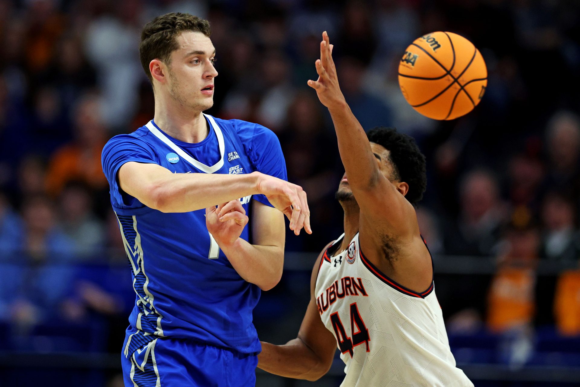 Creighton Bluejays center Ryan Kalkbrenner (11) passes the ball against Auburn Tigers center Dylan Cardwell (44) during the first half in the second round to the NCAA Tournament at Rupp Arena.