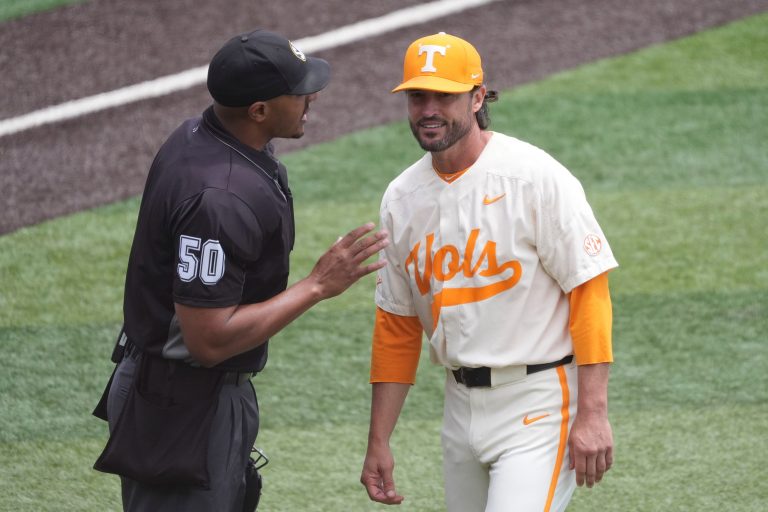 Tennessee baseball coach Tony Vitello talks with plate umpire Javerro January during an NCAA baseball game against Auburn