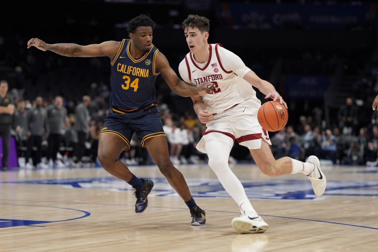 Stanford Cardinal forward Maxime Raynaud (42) drives to the basket against California Golden Bears forward Lee Dort (34) during the second half at Spectrum Center.
