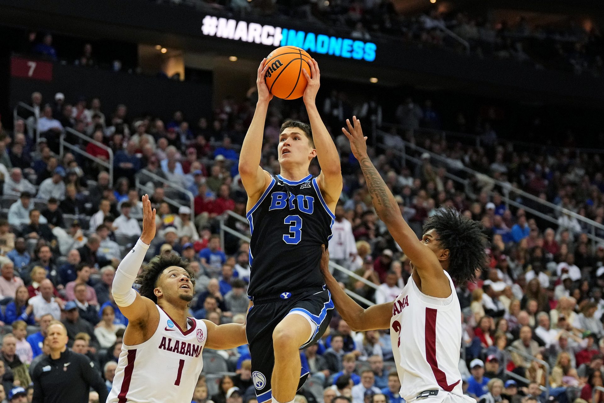 Brigham Young Cougars guard Egor Demin (3) drives to the basket against Alabama Crimson Tide guard Mark Sears (1) during the second half during an East Regional semifinal of the 2025 NCAA tournament at Prudential Center.