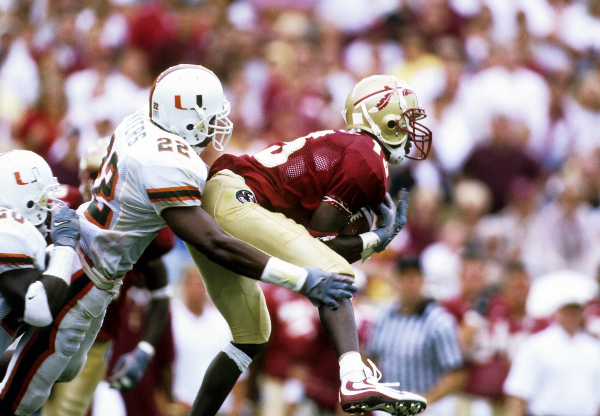 FILE PHOTO; Florida State Seminoles receiver Marvin Minnis (13) makes a catch defended by Miami Hurricanes defensive back Leonard Myers (22) at Doak Campbell Stadium.
