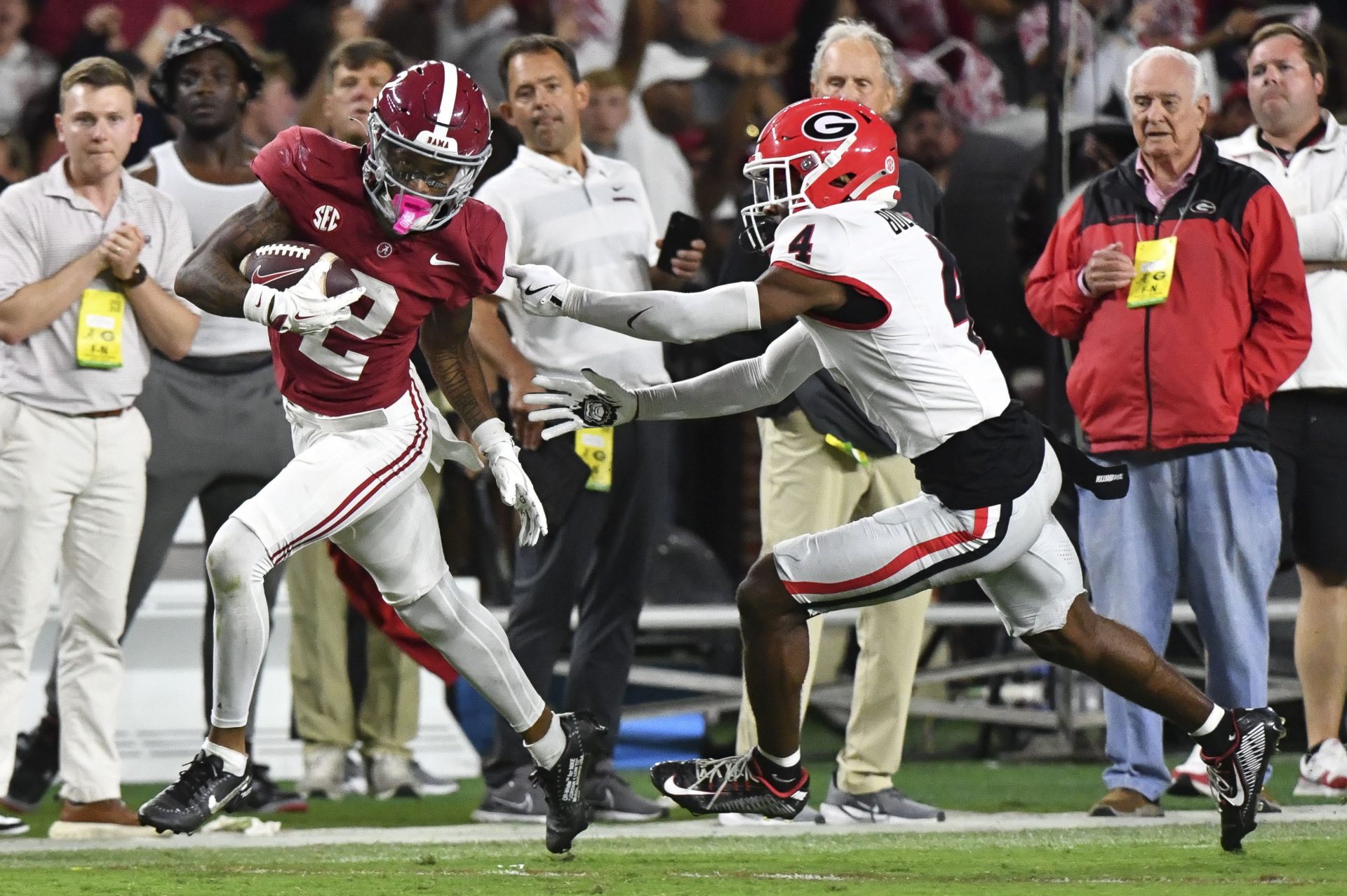 Alabama Crimson Tide wide receiver Ryan Williams (2) breaks a tackle by Georgia Bulldogs defensive back KJ Bolden (4) to score a touchdown that put Alabama ahead in the fourth quarter at Bryant-Denny Stadium. Alabama defeated Georgia 41-34.