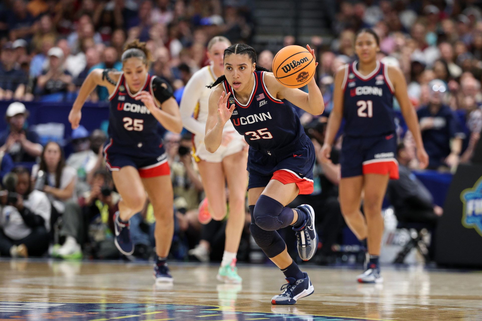 Connecticut Huskies guard Azzi Fudd (35) dribbles the ball against the South Carolina Gamecocks during the first half of the national championship of the women's 2025 NCAA tournament at Amalie Arena.