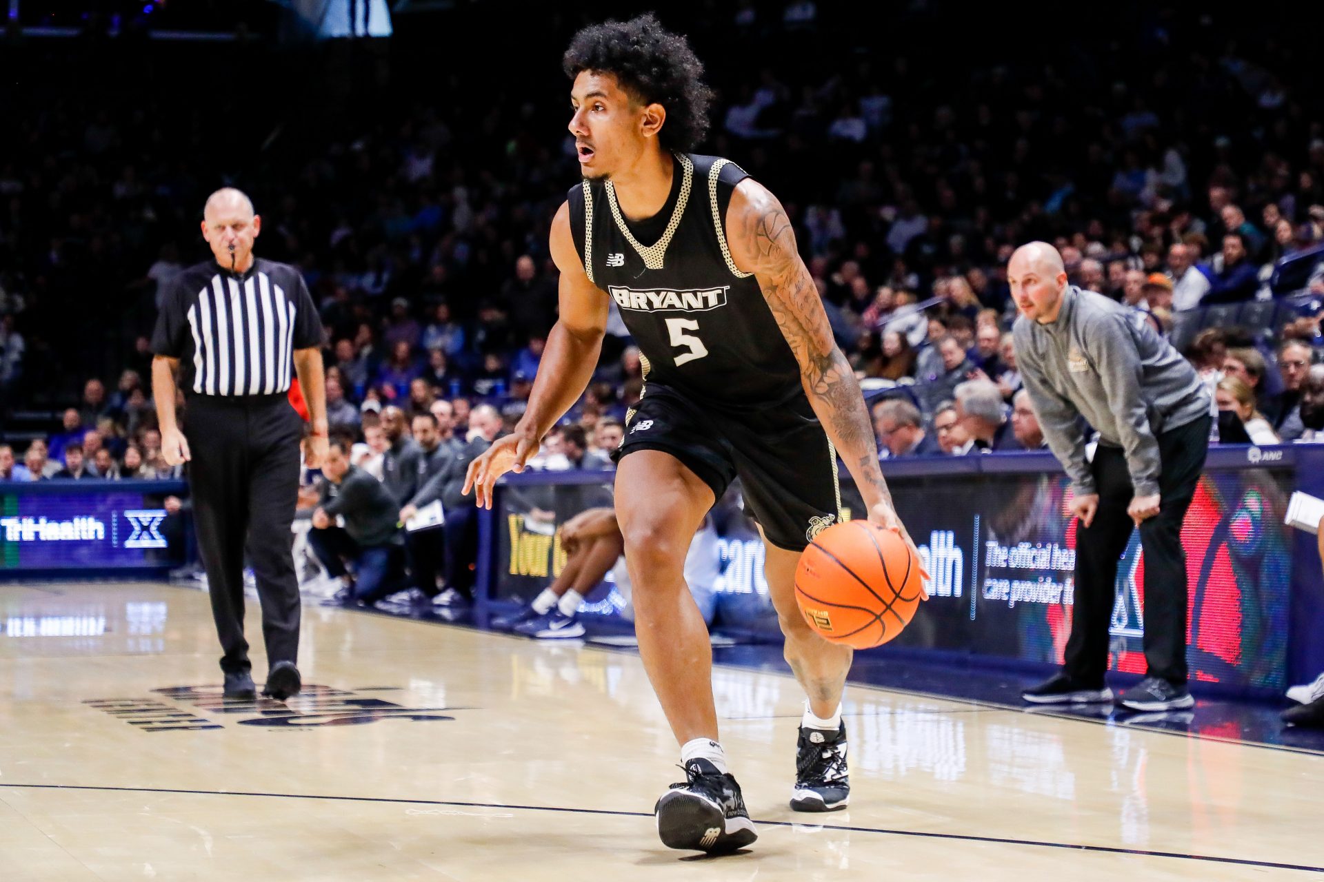 Bryant Bulldogs forward Daniel Rivera (5) dribbles against the Xavier Musketeers in the second half at Cintas Center.