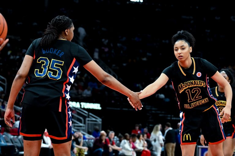 McDonald's All American West guard JuJu Watkins (12) and forward Madison Booker (35) high five during the second half against the McDonald's All American East at Toyota Center.
