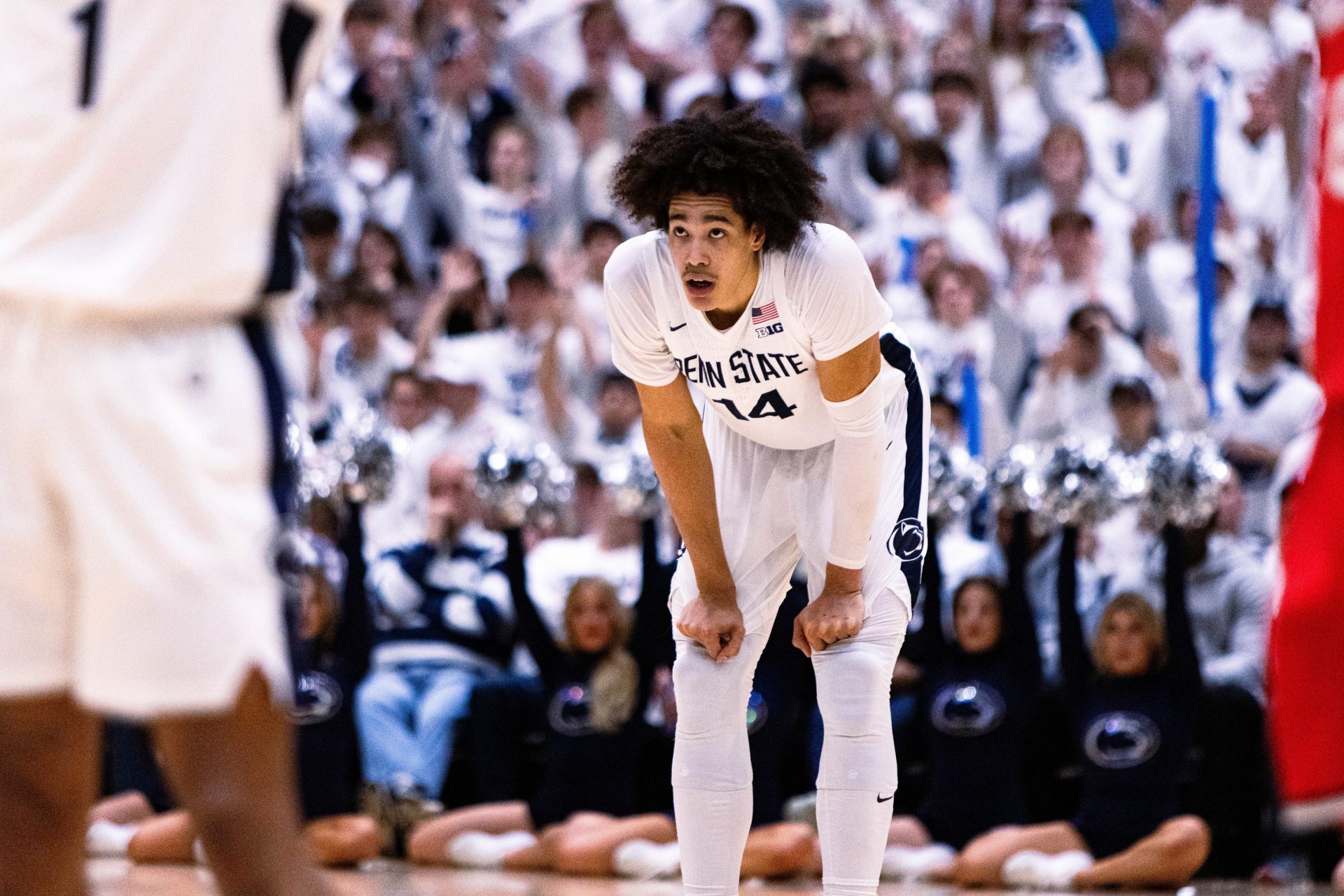 Penn State basketball's Yanic Konan Niederhauser (14) stands in the back during free throws against Ohio State on January 30, 2025