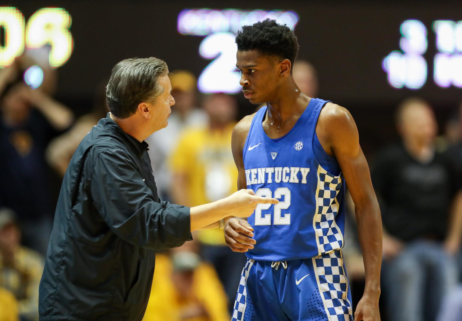 Kentucky Wildcats head coach John Calipari talks with Kentucky Wildcats guard Shai Gilgeous-Alexander (22) during the first half against the West Virginia Mountaineers at WVU Coliseum.