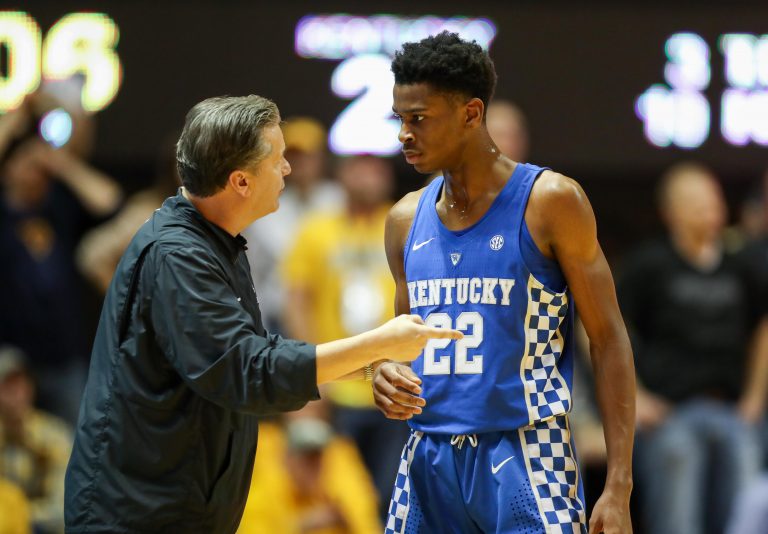 Kentucky Wildcats head coach John Calipari talks with Kentucky Wildcats guard Shai Gilgeous-Alexander (22) during the first half against the West Virginia Mountaineers at WVU Coliseum.