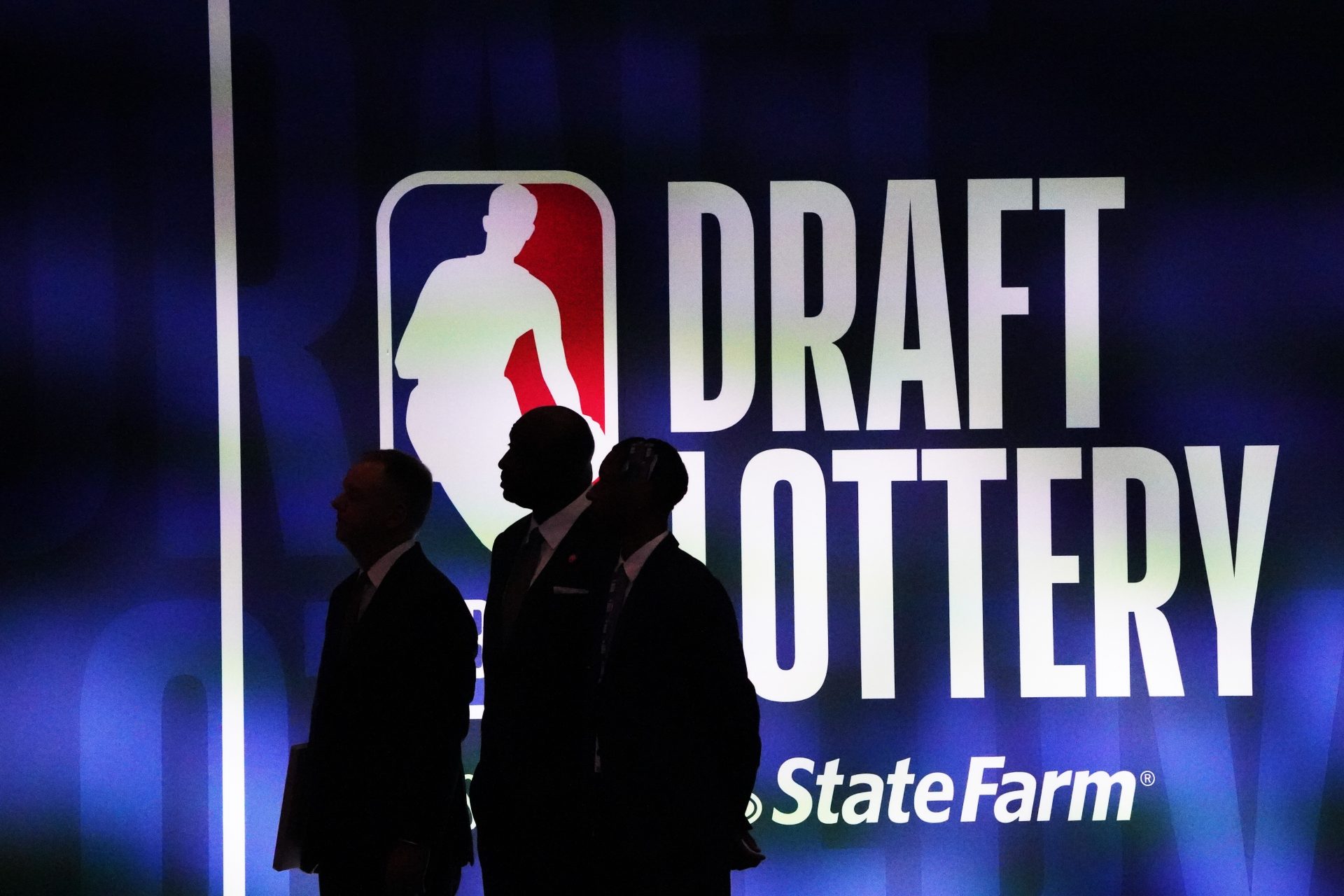 People walk past the 2023 NBA Draft Lottery board at McCormick Place West.