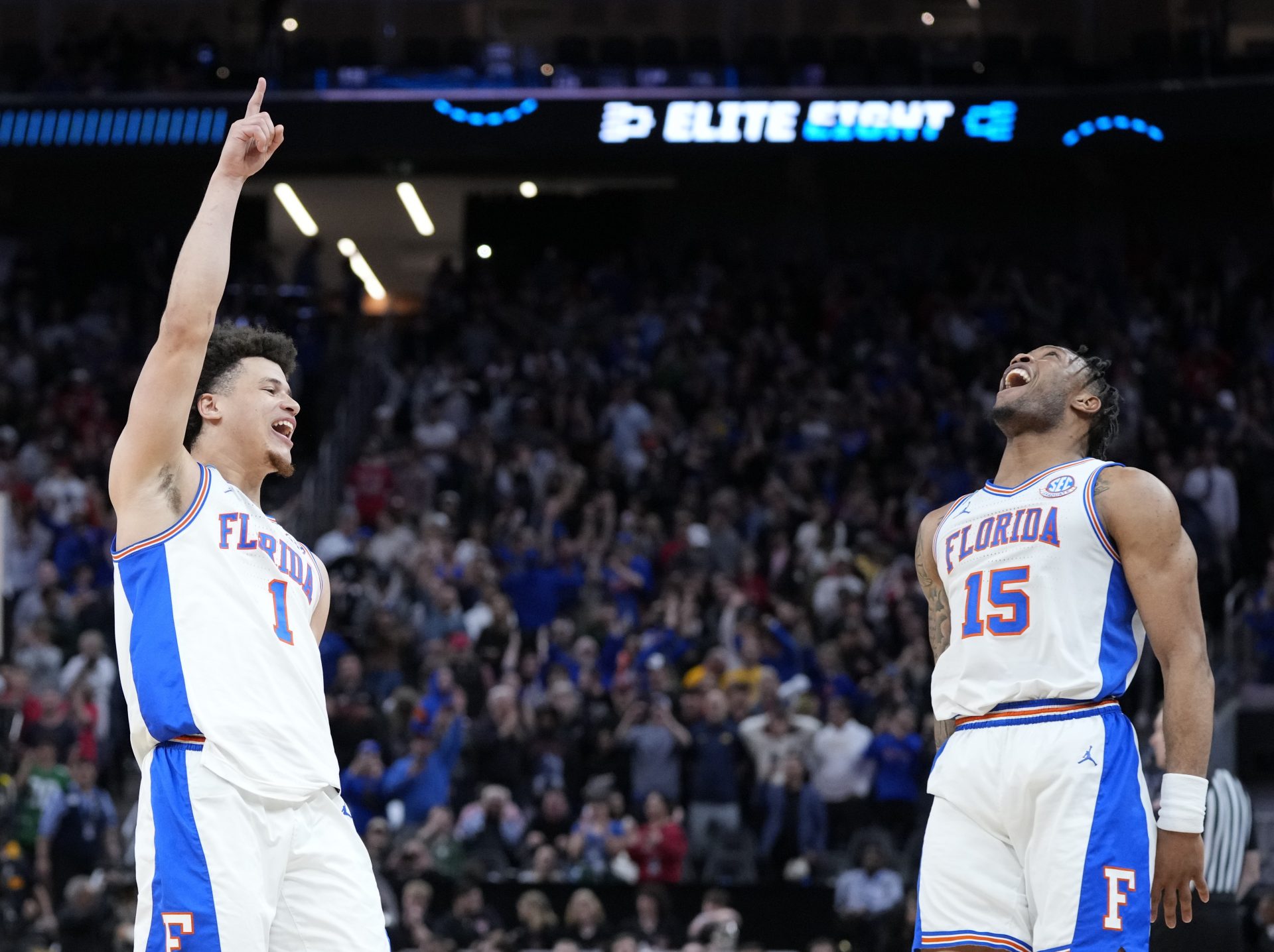 Florida Gators guard Walter Clayton Jr. (1) and guard Alijah Martin (15) celebrate defeating the Texas Tech Red Raiders during the West Regional final of the 2025 NCAA tournament at Chase Center.