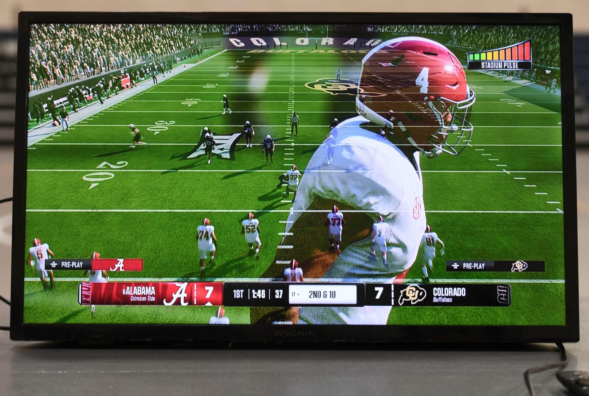 An image of Alabama quarterback Jalen Milroe fades from the screen as kids play the new EA Sports College Football 25 video game at the McDonald Hughes Center in Tuscaloosa.