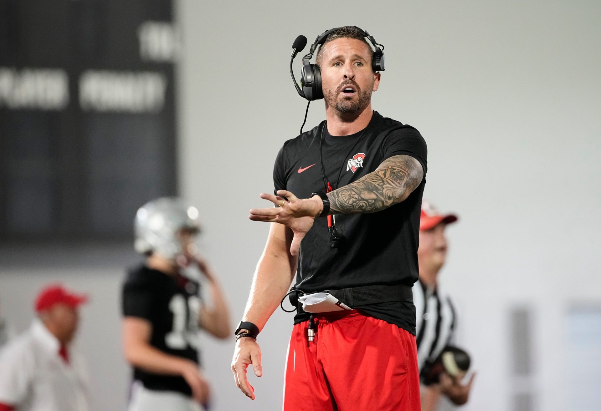 Ohio State Buckeyes offensive coordinator Brian Hartline motions during spring football practice at the Woody Hayes Athletic Center in Columbus on March 19, 2025.