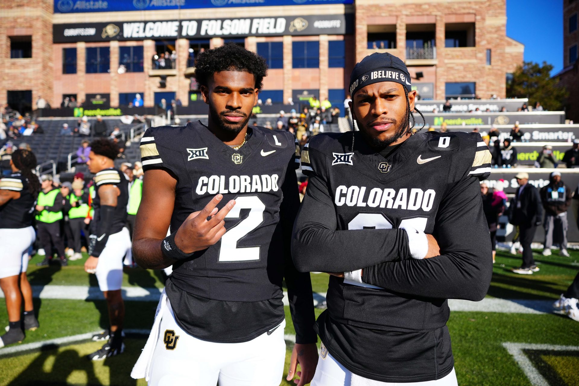 Colorado Buffaloes quarterback Shedeur Sanders (2) and safety Shilo Sanders (21) before the game against the Oklahoma State Cowboys at Folsom Field.