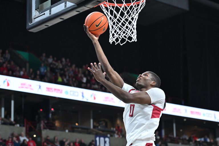 Washington State Cougars guard Cedric Coward (0) makes an easy lay up against the Eastern Washington Eagles in the first half at Spokane Veterans Memorial Arena.