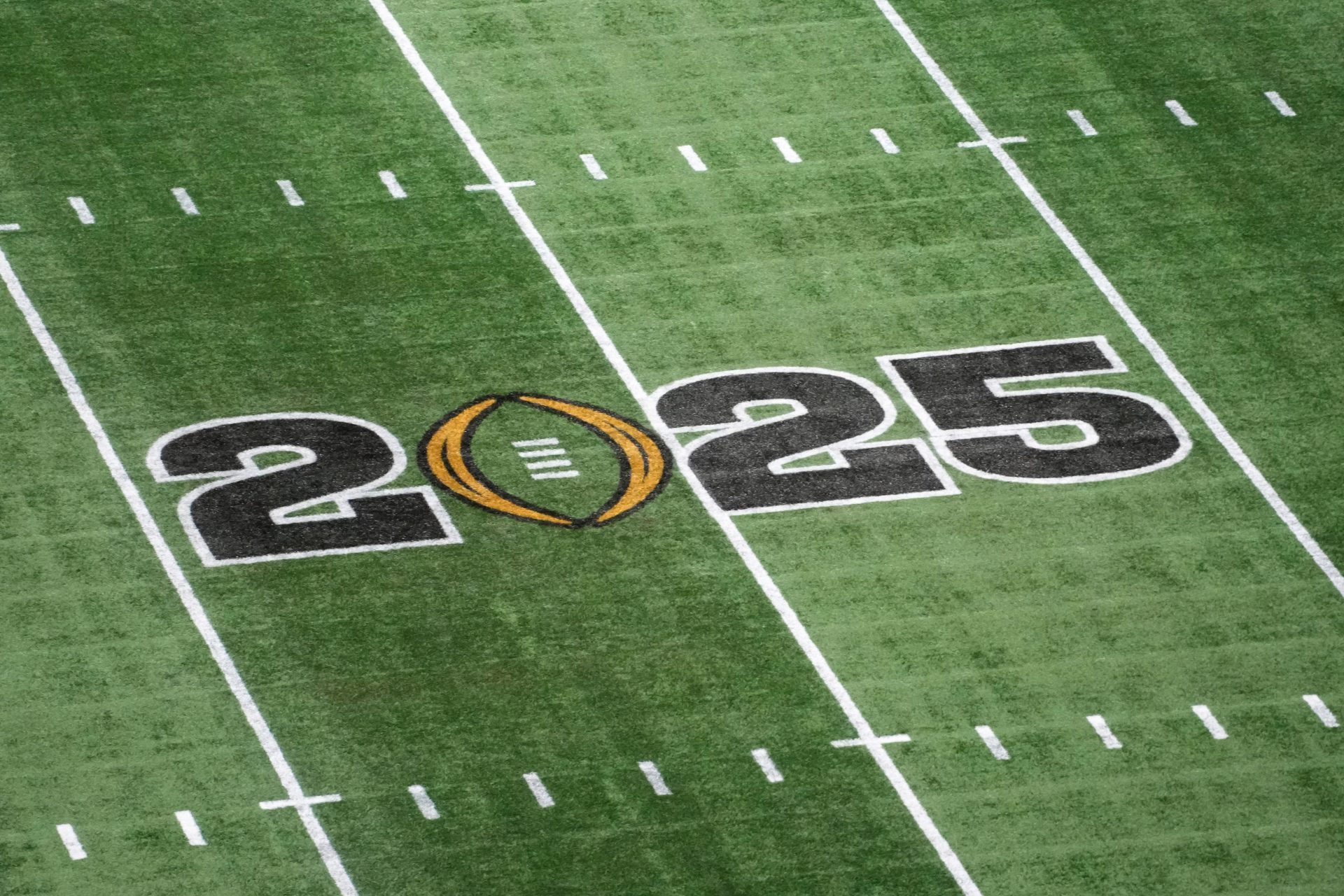 The College Football Playoff National Championship logo on the field at Mercedes-Benz Stadium, the site of the 2025 College Football Playoff National Championship between the Ohio State Buckeyes and the Notre Dame Fighting Irish.
