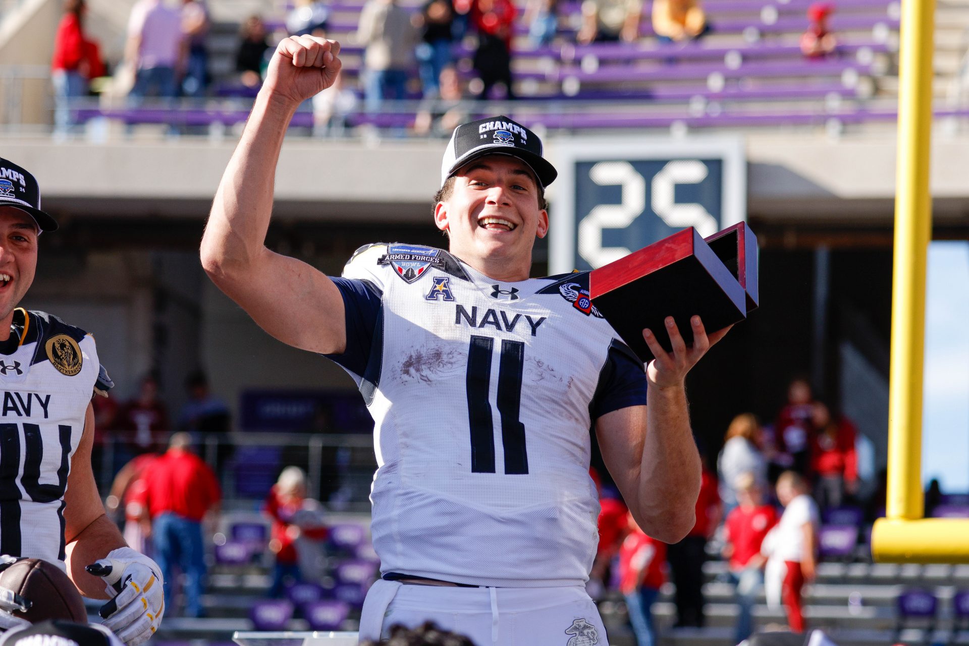 Navy Midshipmen quarterback Blake Horvath (11) celebrates winning the MVP after the game against the Oklahoma Sooners at Amon G. Carter Stadium.