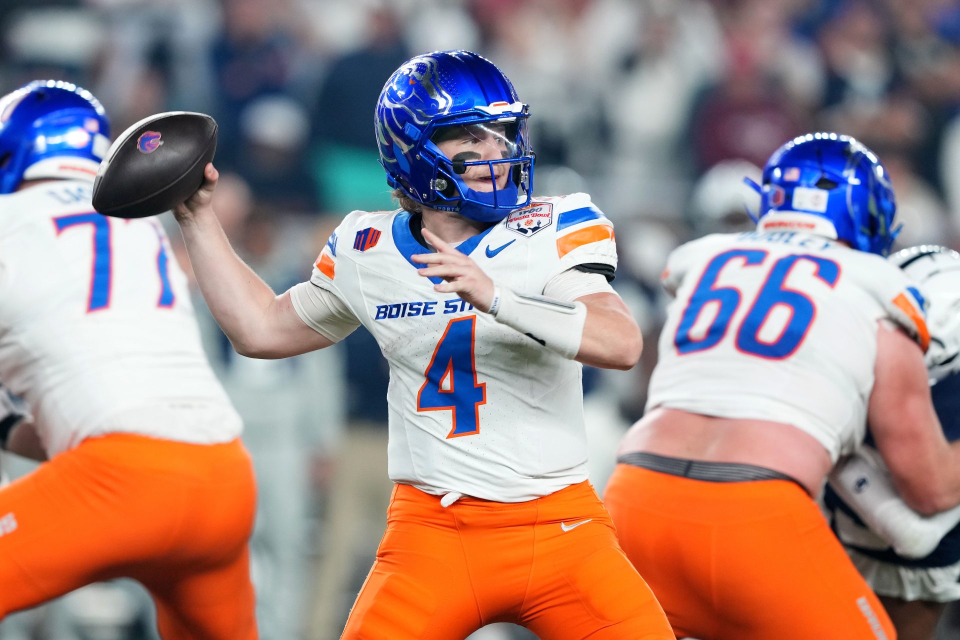 Boise State Broncos quarterback Maddux Madsen (4) drops back to pass against the Penn State Nittany Lions during the first half in the Fiesta Bowl at State Farm Stadium.