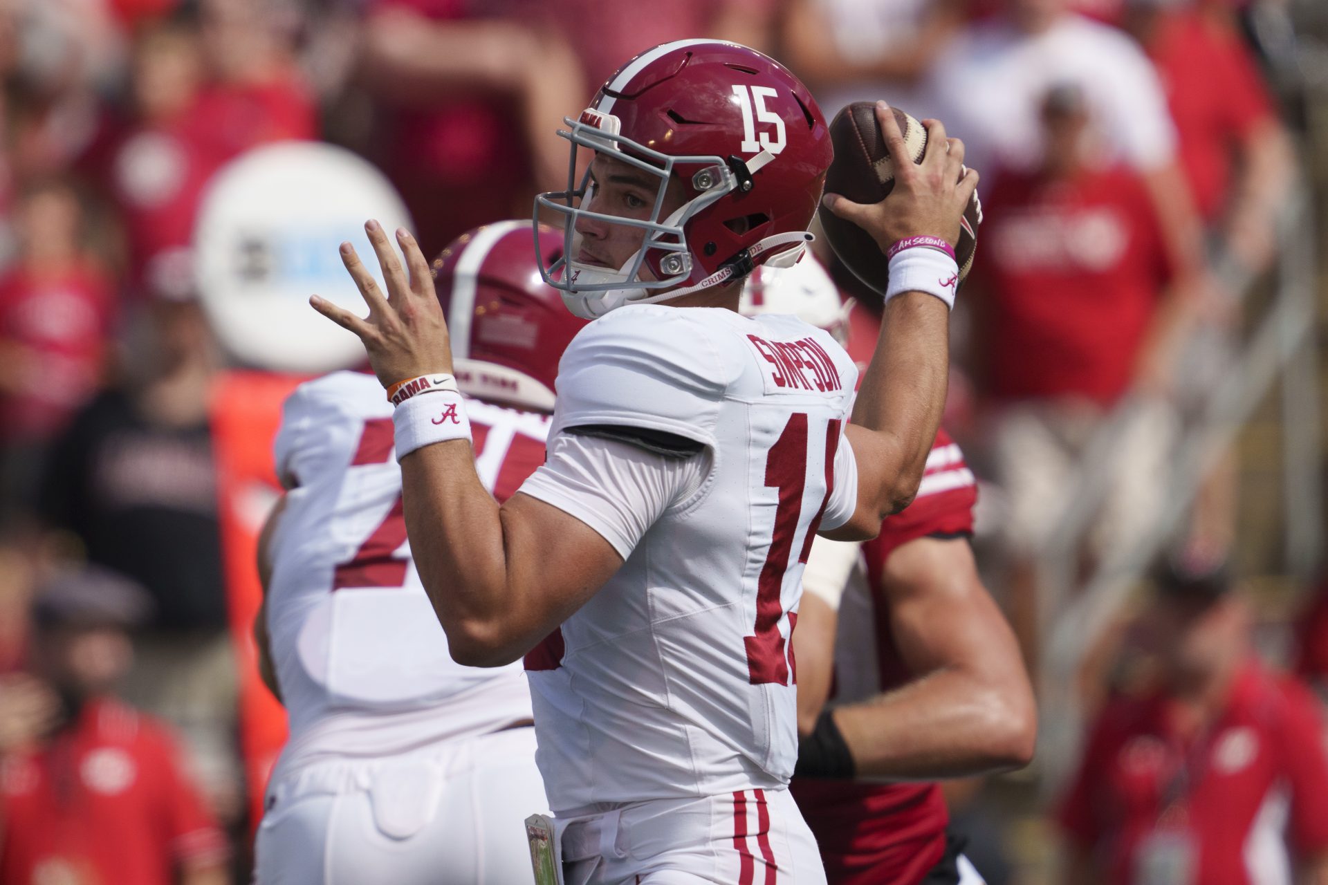 Alabama Crimson Tide quarterback Ty Simpson (15) throws a pass during the fourth quarter against the Wisconsin Badgers at Camp Randall Stadium.