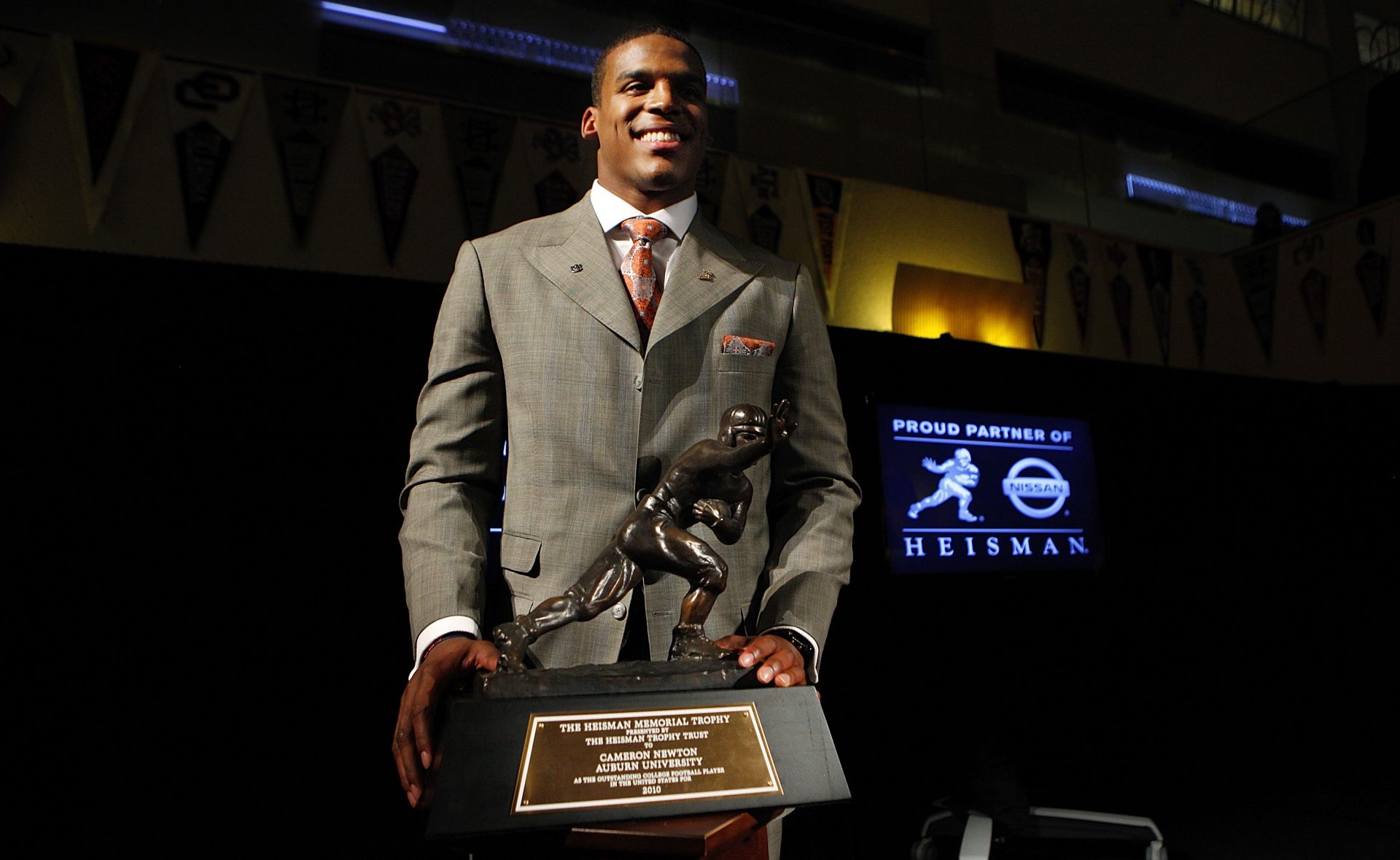 NEW YORK - DECEMBER 11:  Cam Newton, quarterback of the Auburn University Tigers, poses with the 2010 Heisman Memorial Trophy Award on December 11, 2010 in New York City.  (Photo by Jeff Zelevansky/Getty Images)
