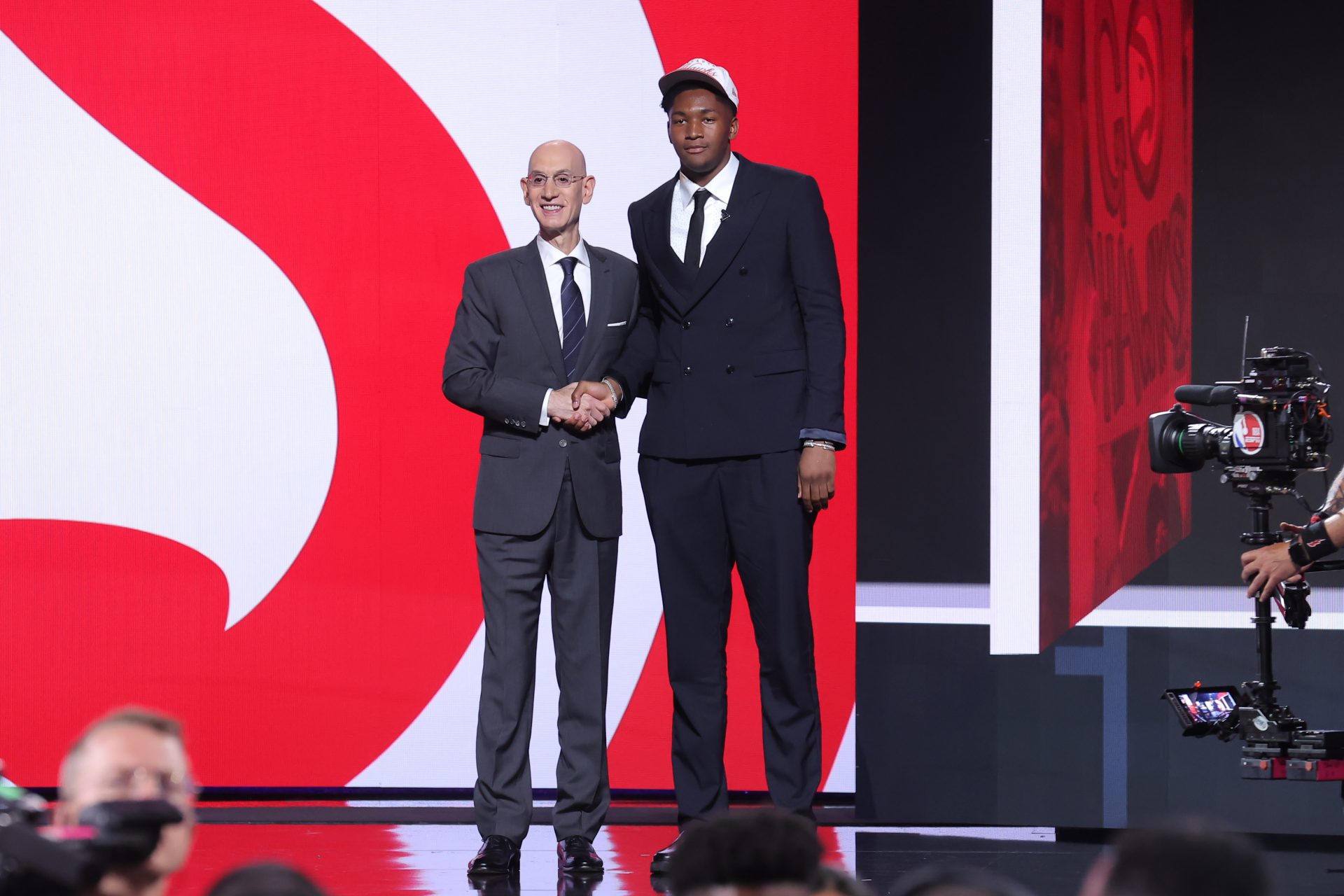 Derik Queen stands with NBA commissioner Adam Silver after being selected as the 13th pick by the Atlanta Hawks in the first round of the 2025 NBA Draft at Barclays Center.